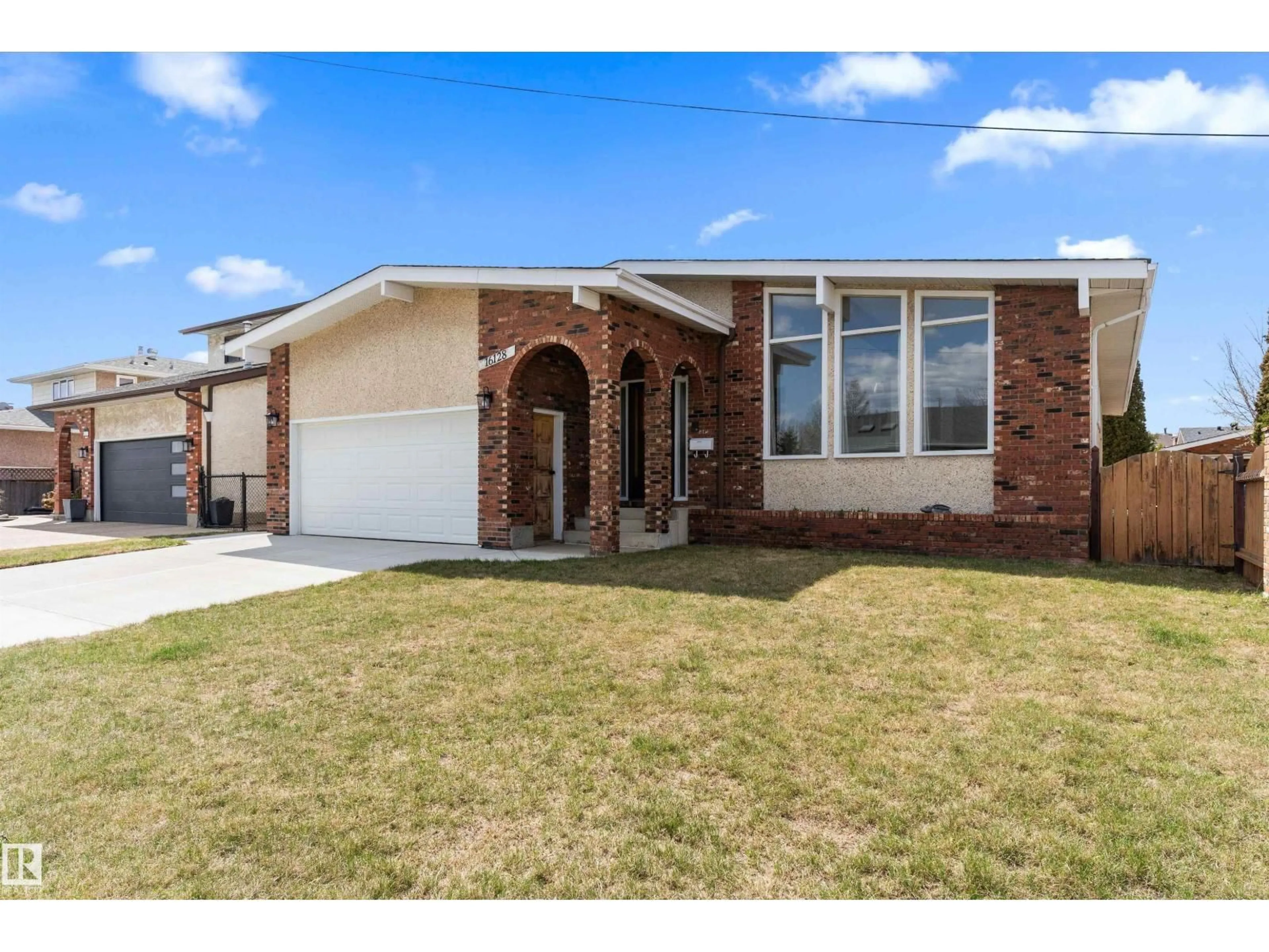 Home with brick exterior material, street for NW - 16128 98 ST, Edmonton Alberta T5X4Y7