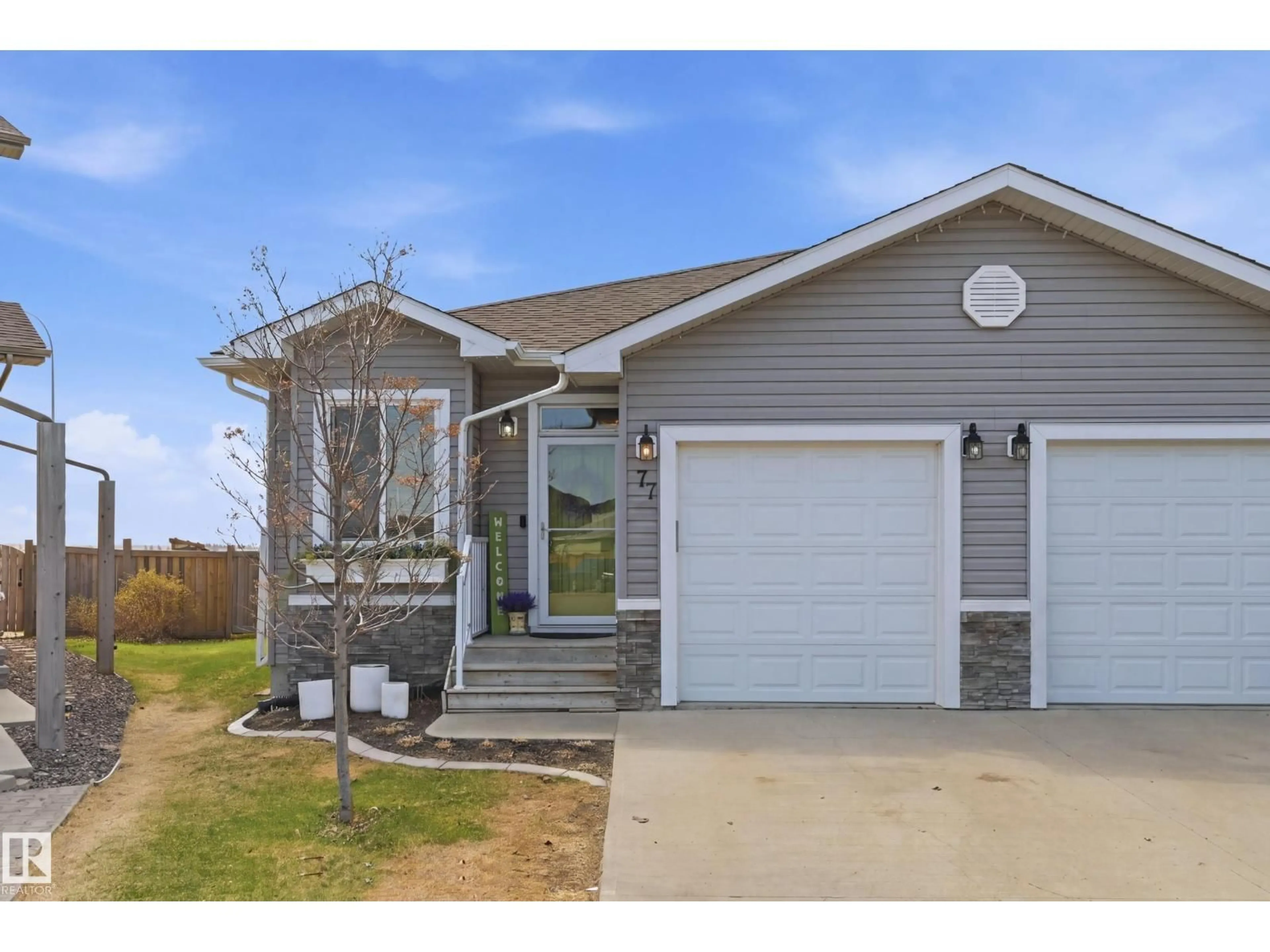 Home with vinyl exterior material, street for 77 RICHMOND LI, Fort Saskatchewan Alberta T8L0S2