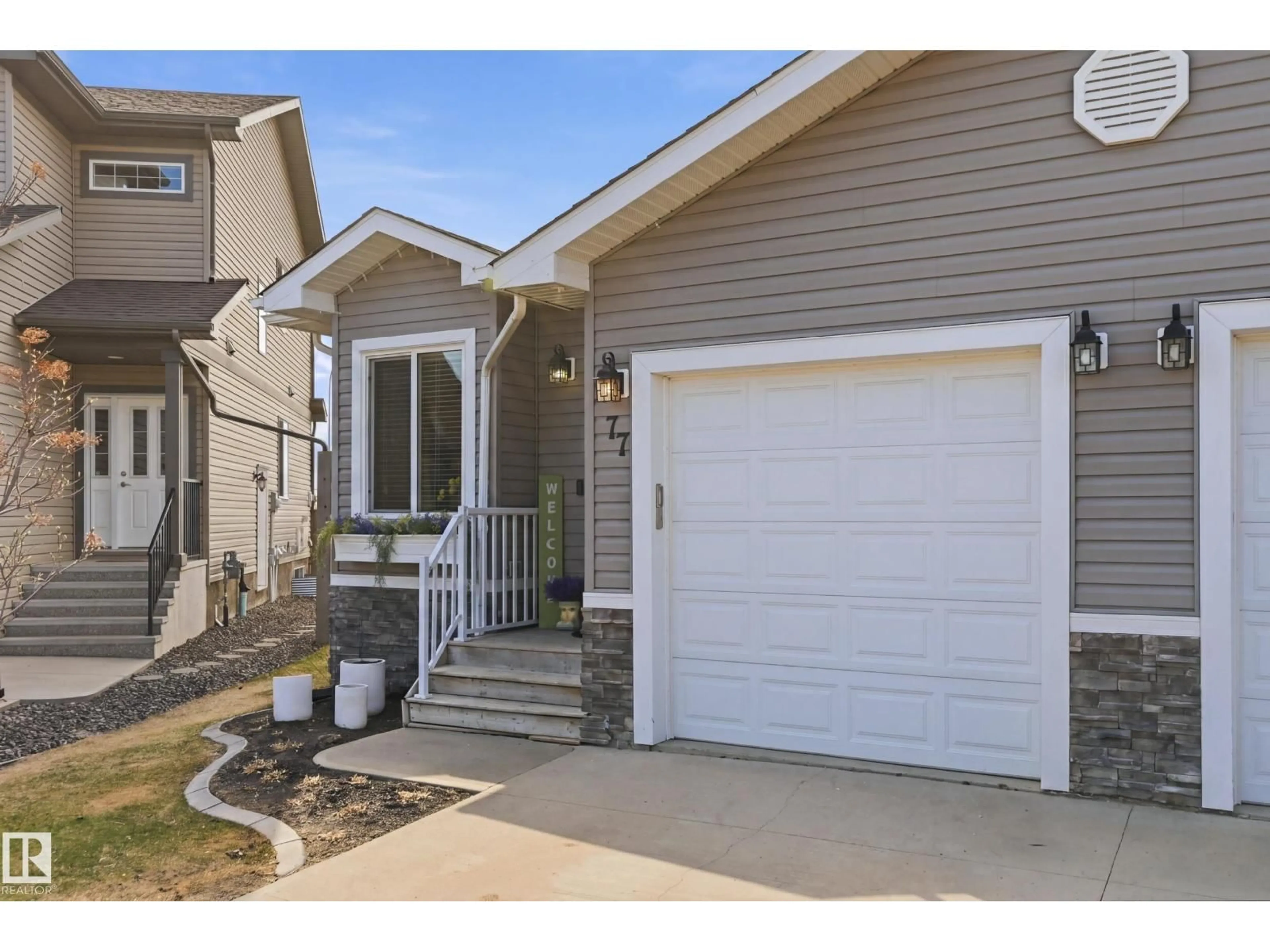 Home with vinyl exterior material, street for 77 RICHMOND LI, Fort Saskatchewan Alberta T8L0S2