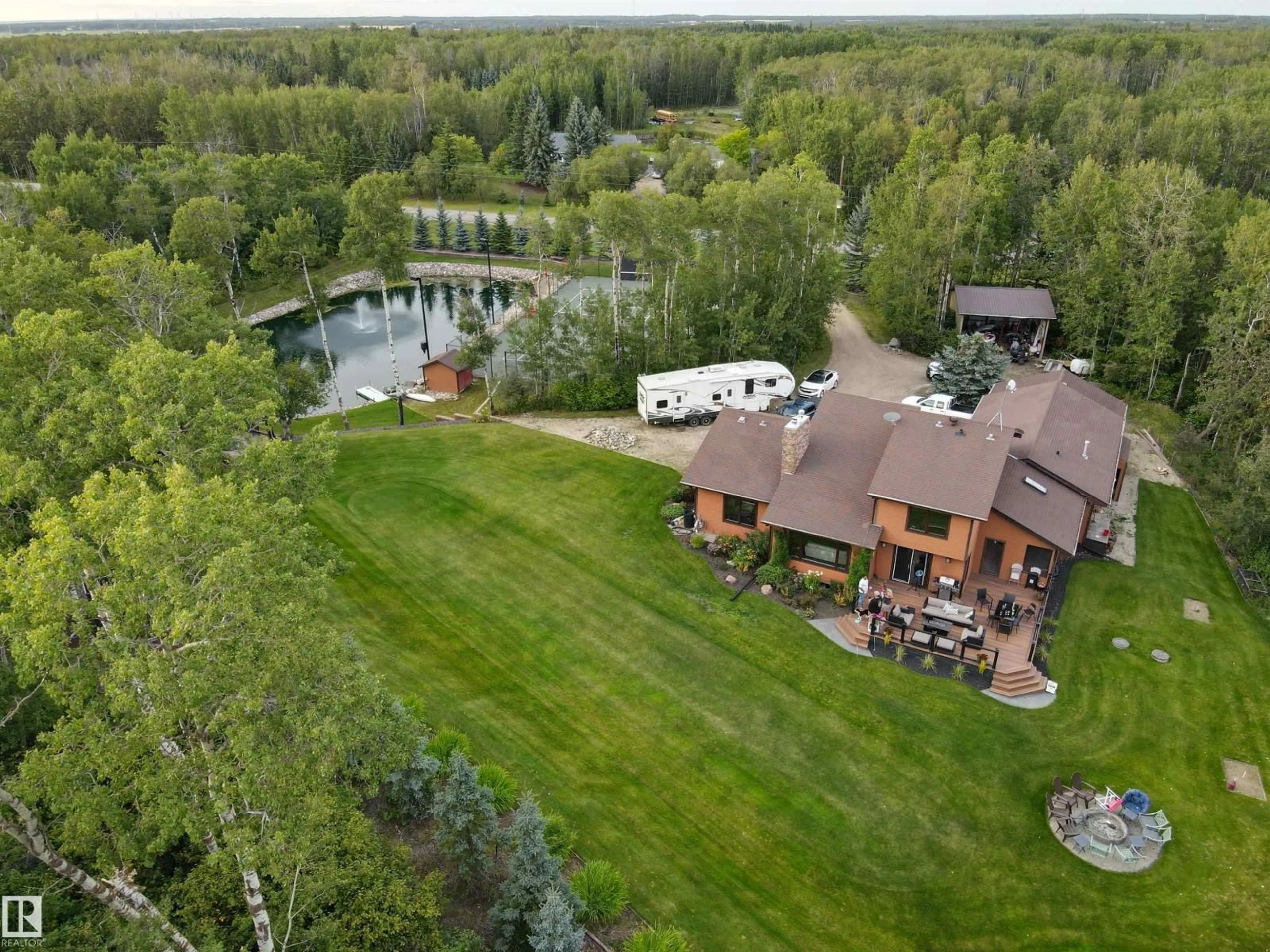 A pic from outside/outdoor area/front of a property/back of a property/a pic from drone, water/lake/river/ocean view for 97 - 51313 RGE ROAD 231, Rural Strathcona County Alberta T6B1K7