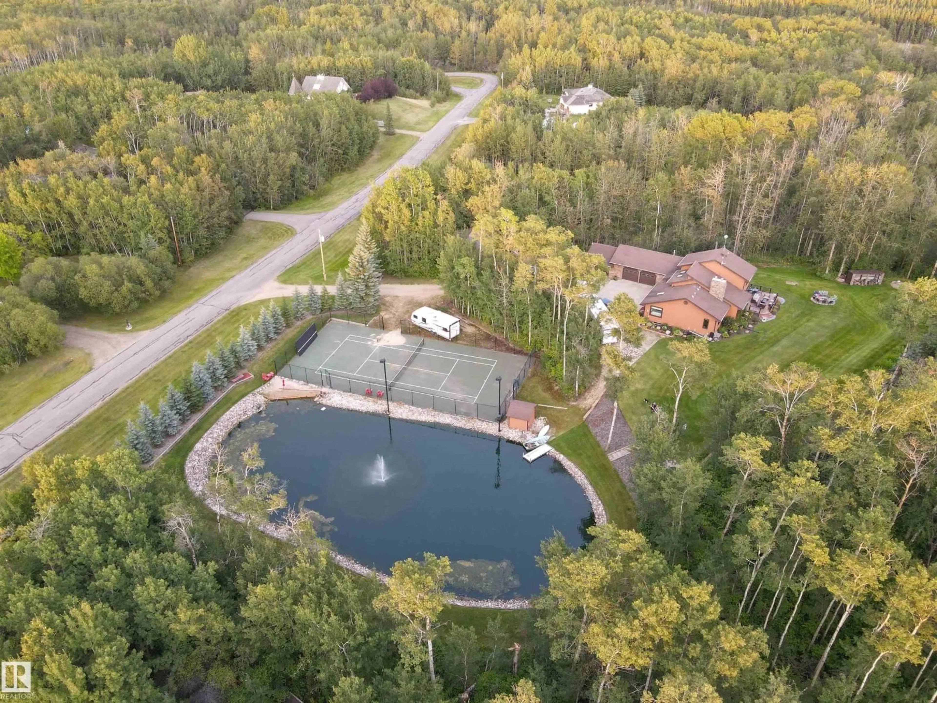 A pic from outside/outdoor area/front of a property/back of a property/a pic from drone, water/lake/river/ocean view for 97 - 51313 RGE ROAD 231, Rural Strathcona County Alberta T6B1K7