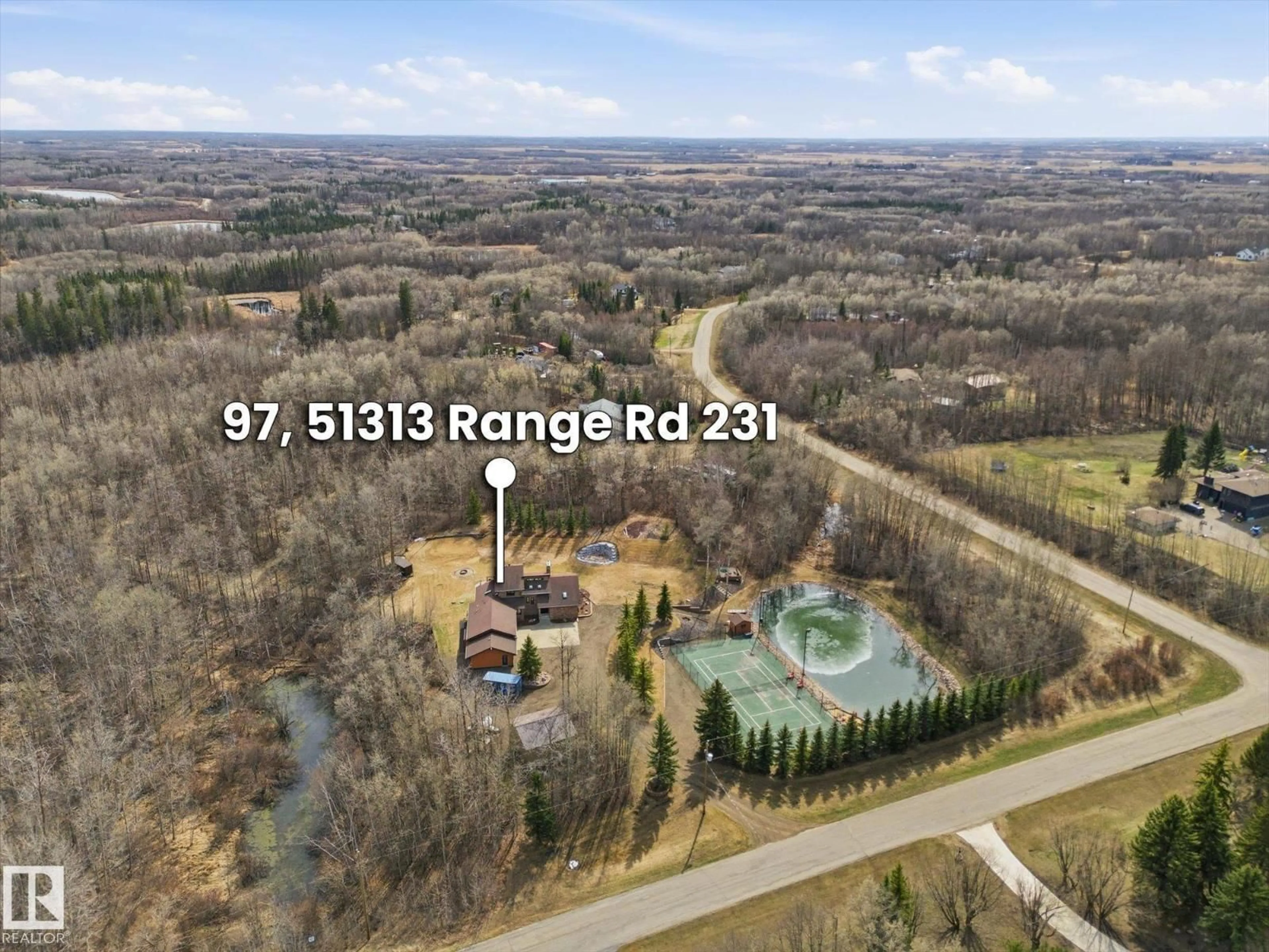 A pic from outside/outdoor area/front of a property/back of a property/a pic from drone, water/lake/river/ocean view for 97 - 51313 RGE ROAD 231, Rural Strathcona County Alberta T6B1K7