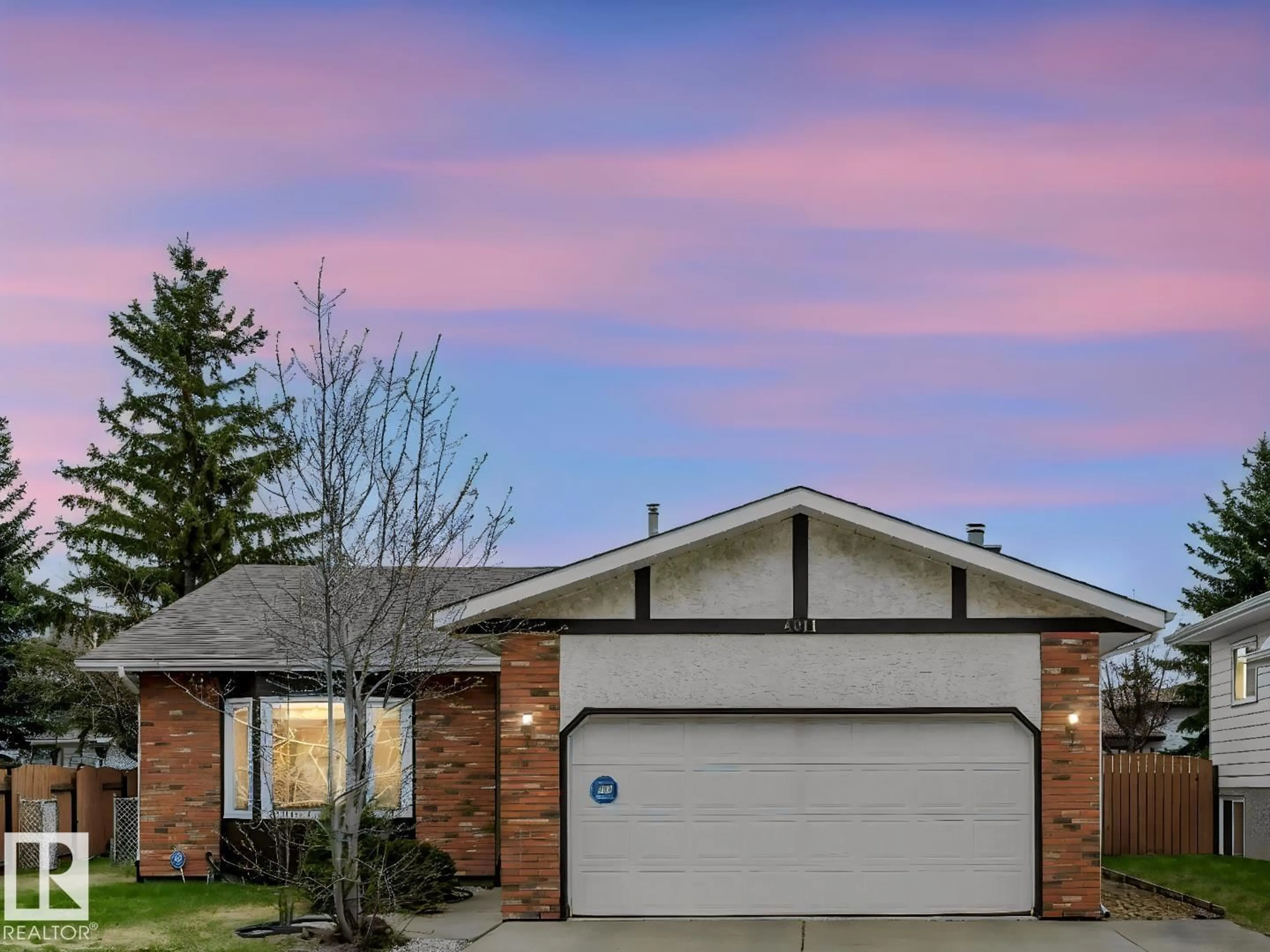 Home with brick exterior material, street for NW - 4011 104 ST, Edmonton Alberta T6J6K9