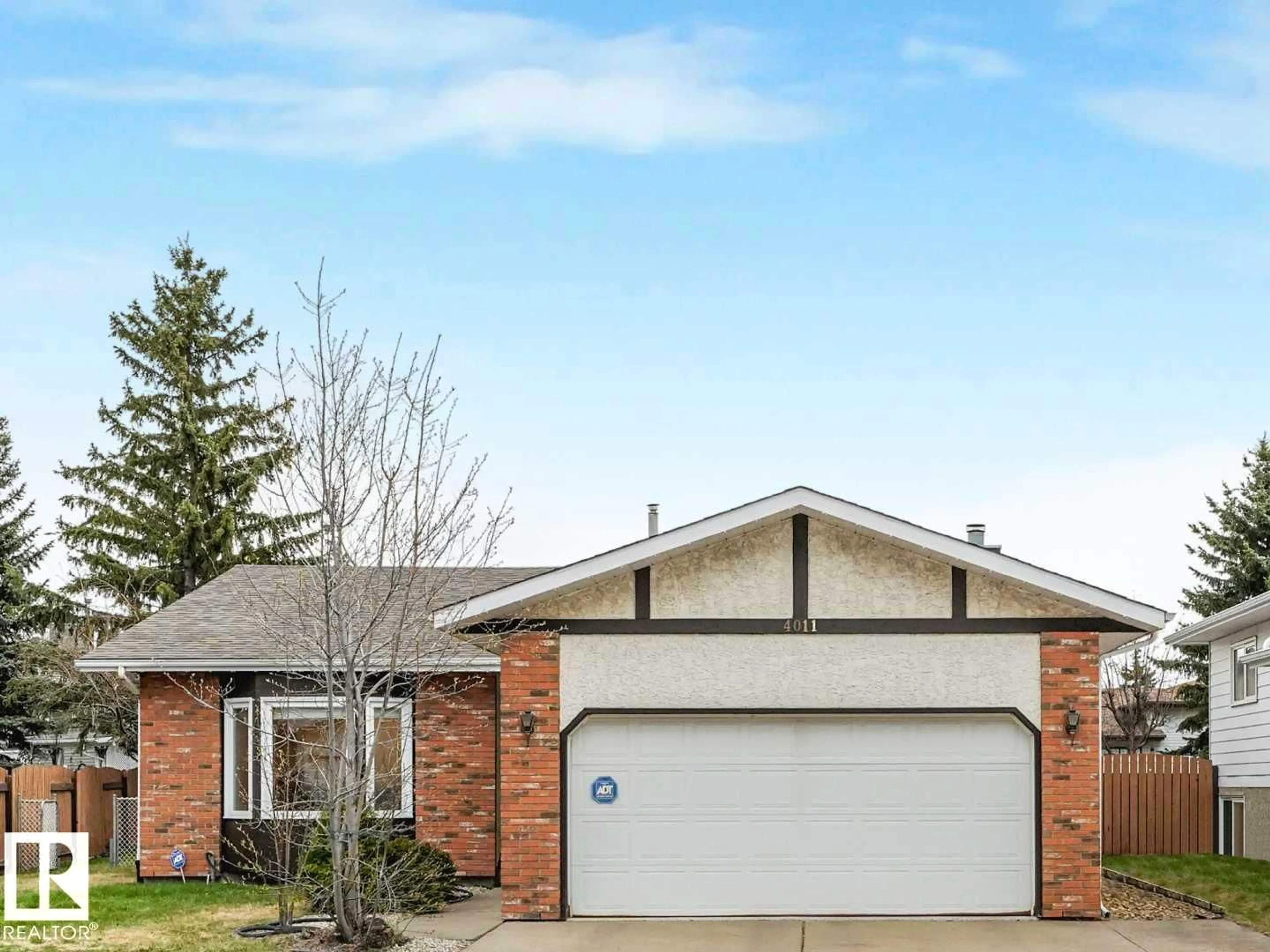 Home with brick exterior material, street for NW - 4011 104 ST, Edmonton Alberta T6J6K9