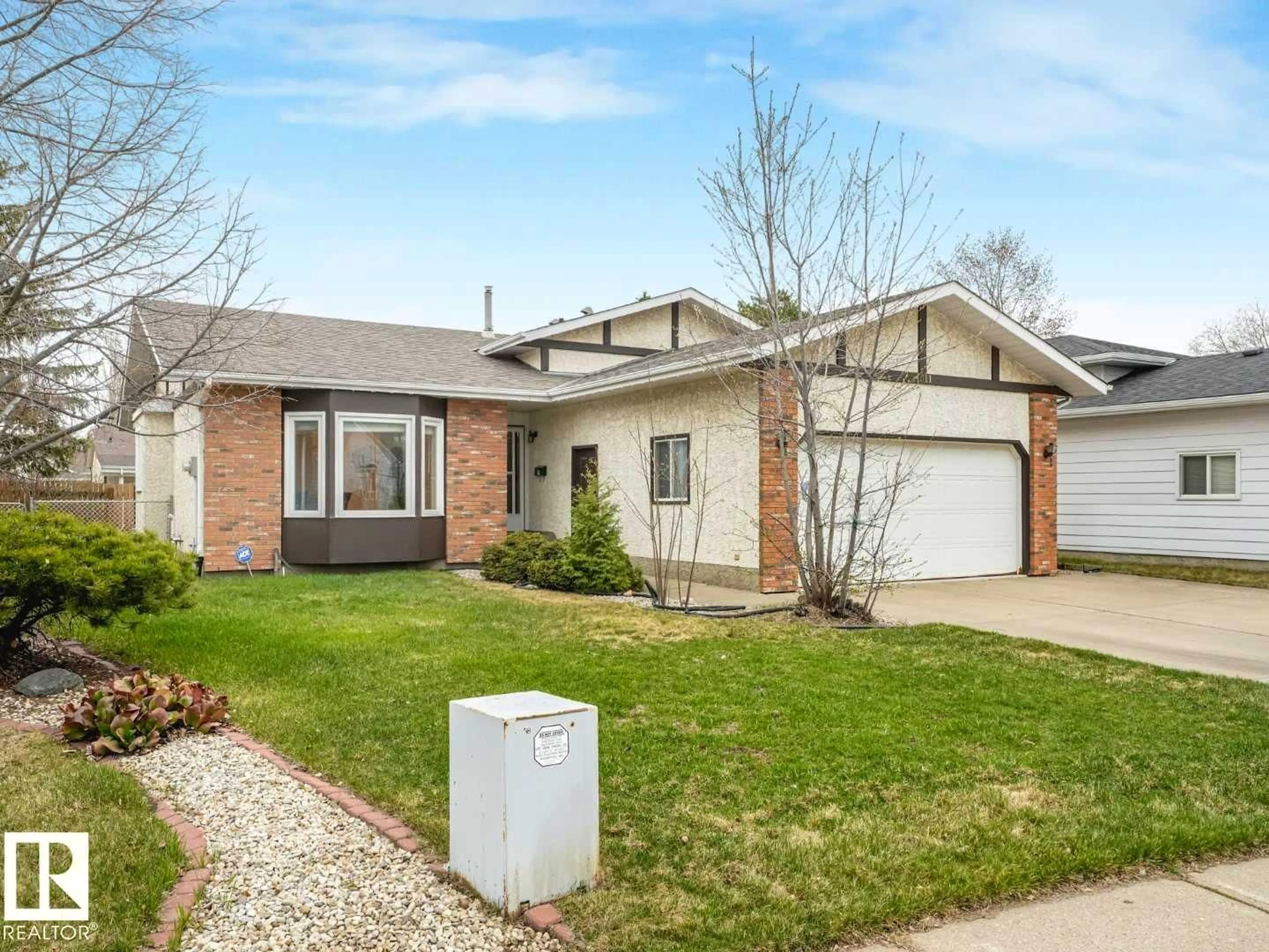Home with brick exterior material, street for NW - 4011 104 ST, Edmonton Alberta T6J6K9