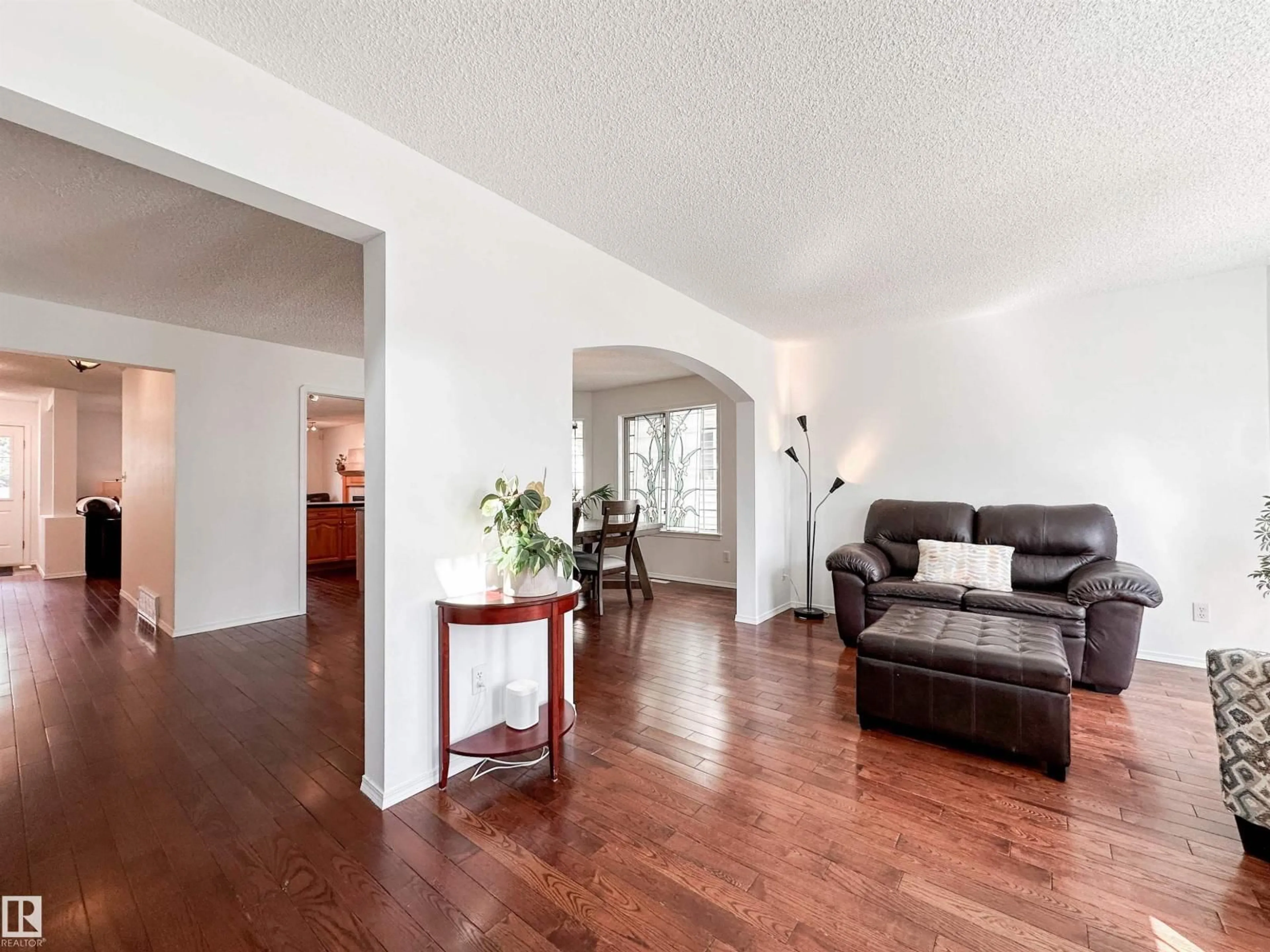 Living room with furniture, wood/laminate floor for 10020 97 AV, Edmonton Alberta T5K0B1