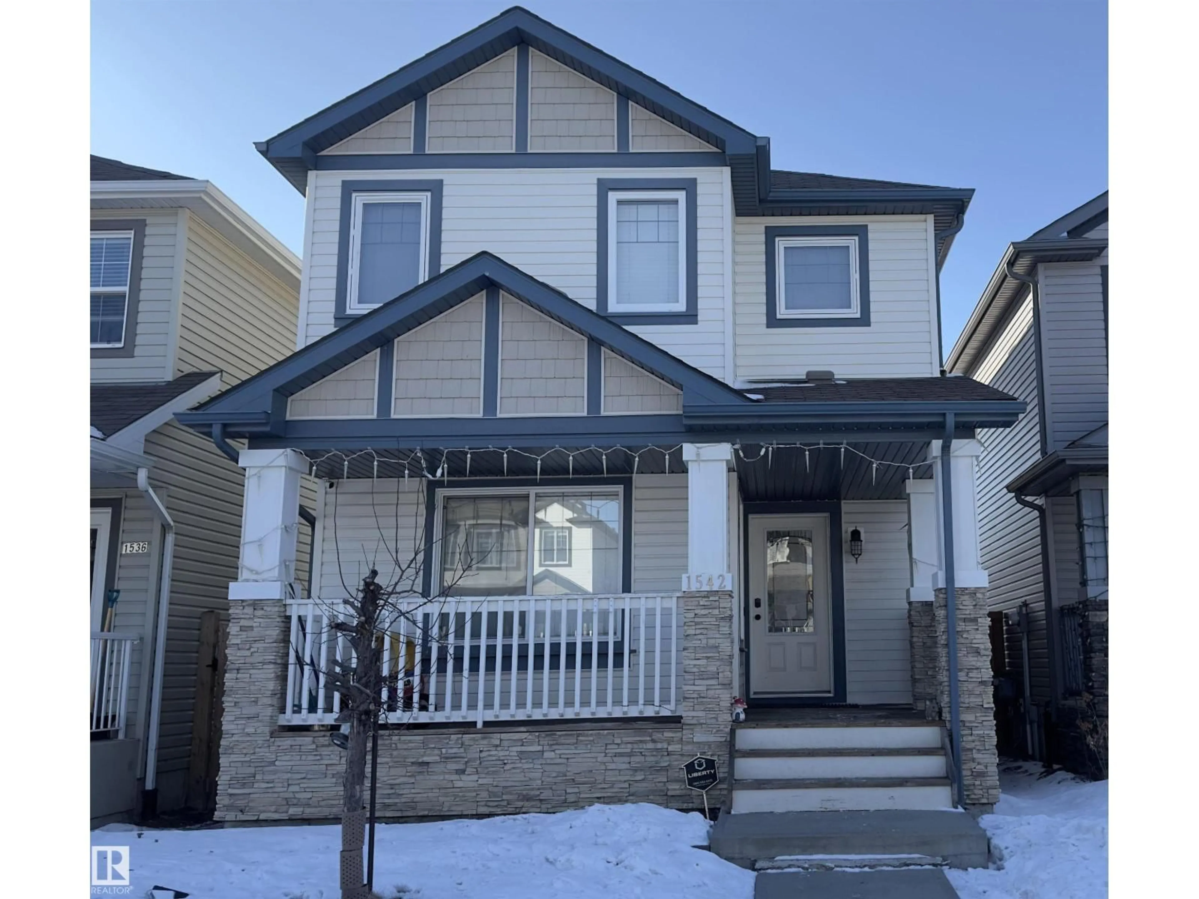 Home with vinyl exterior material, street for NW - 1542 33A ST, Edmonton Alberta T6T0X5