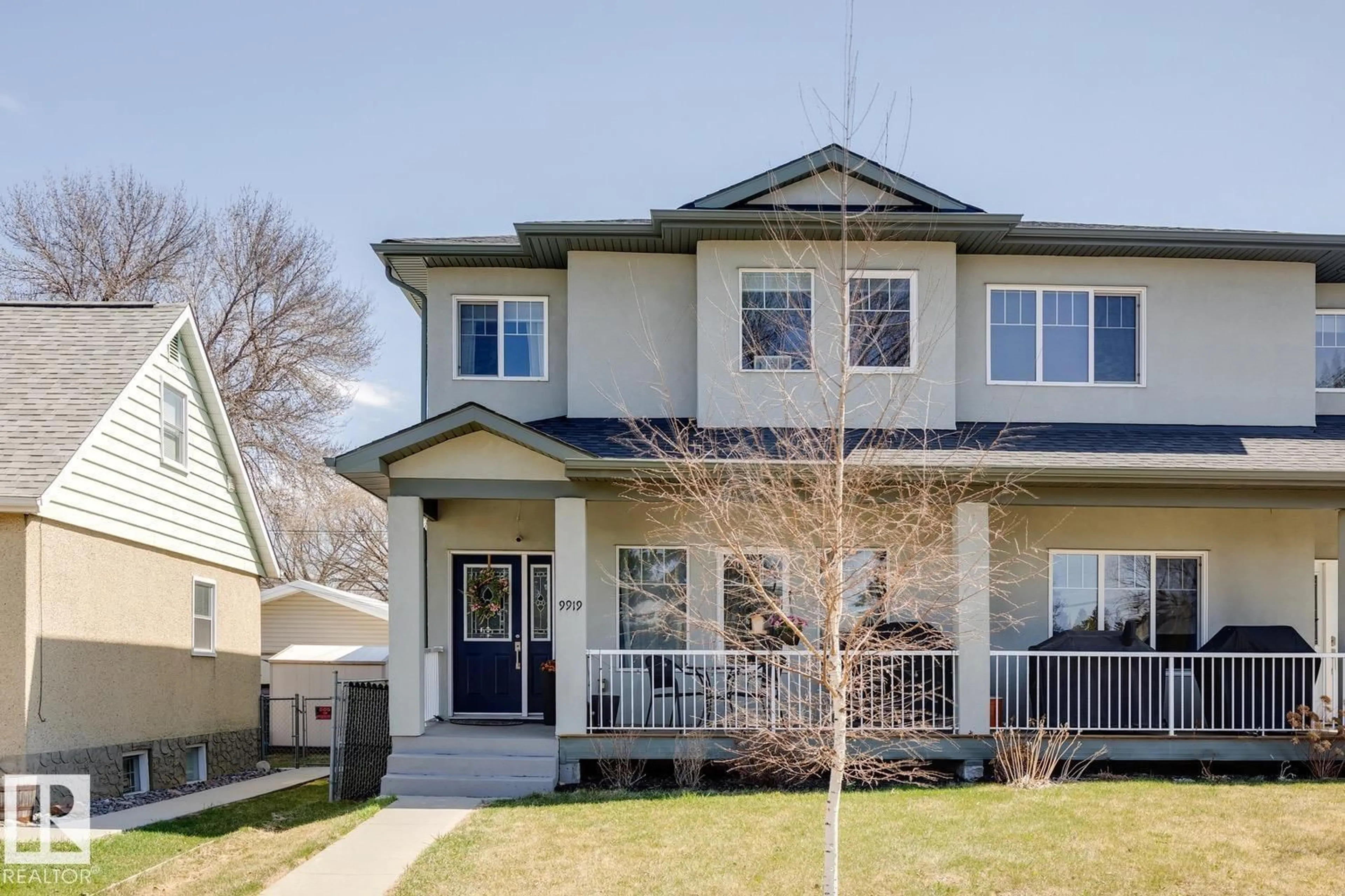 Home with vinyl exterior material, street for NW - 9919 79 ST, Edmonton Alberta T6A3G2