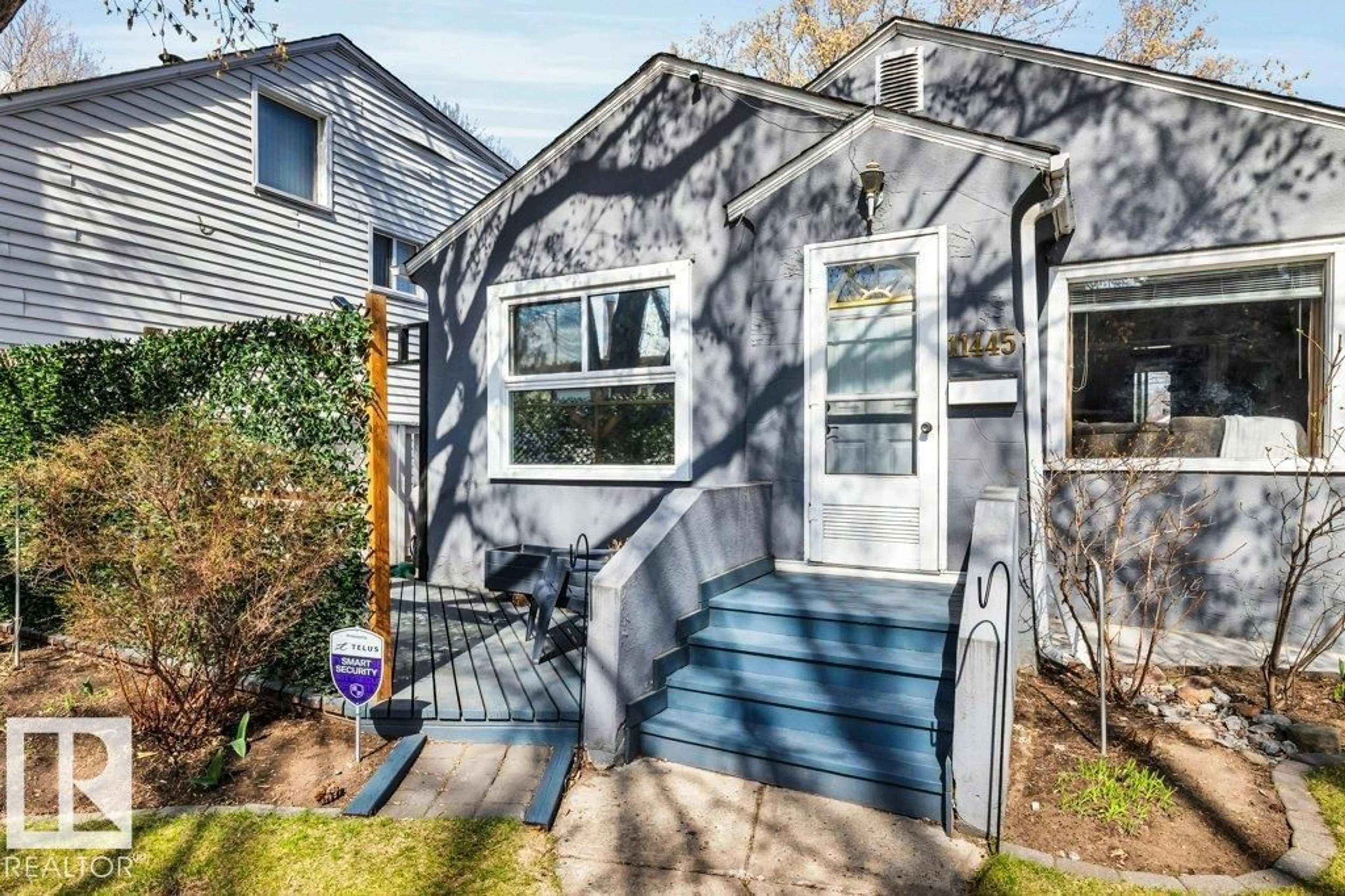 Home with vinyl exterior material, street for NW - 11445 68 ST, Edmonton Alberta T5B1N9
