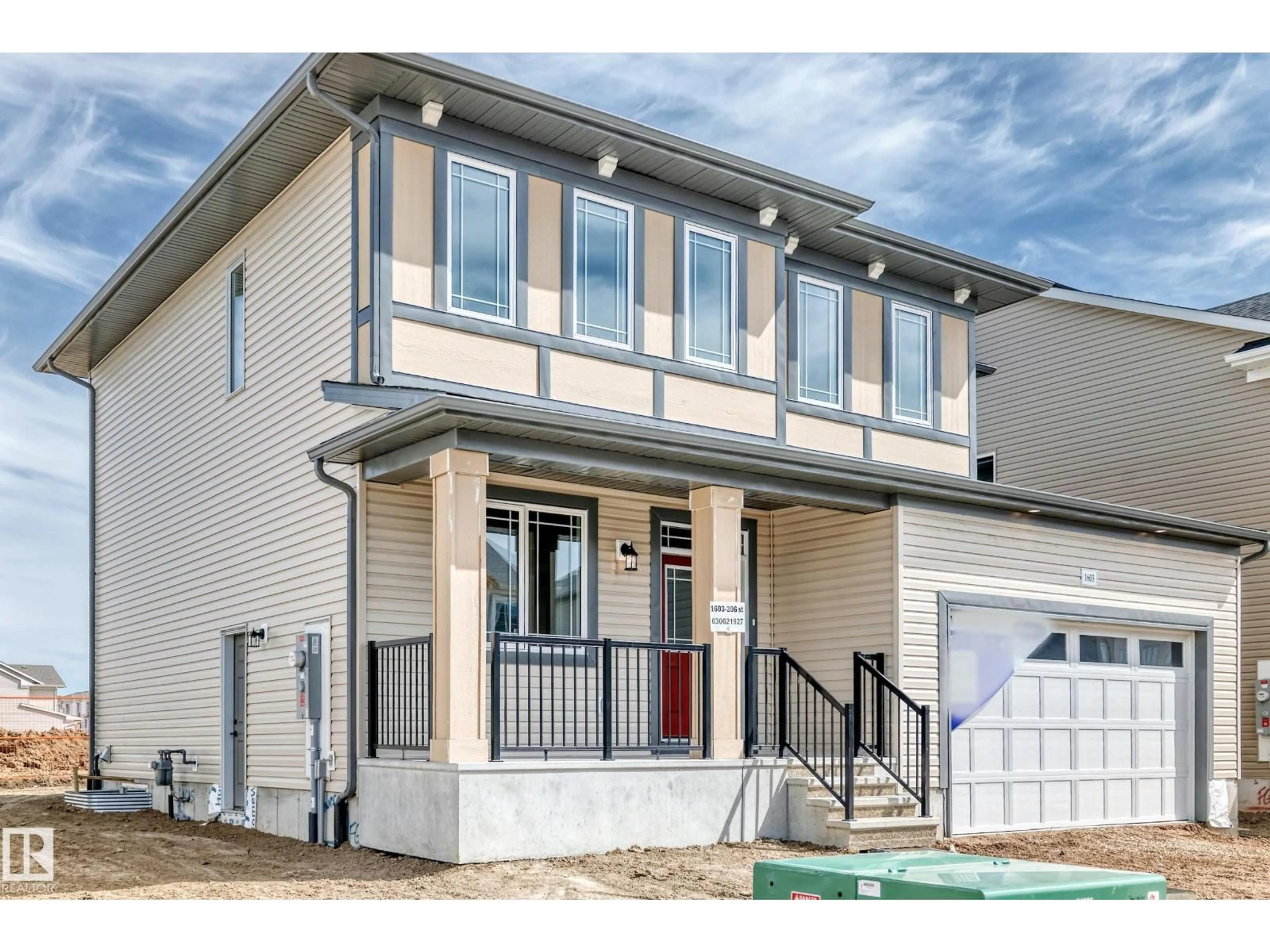Home with vinyl exterior material, street for 1603 206 ST, Edmonton Alberta T6M3E7