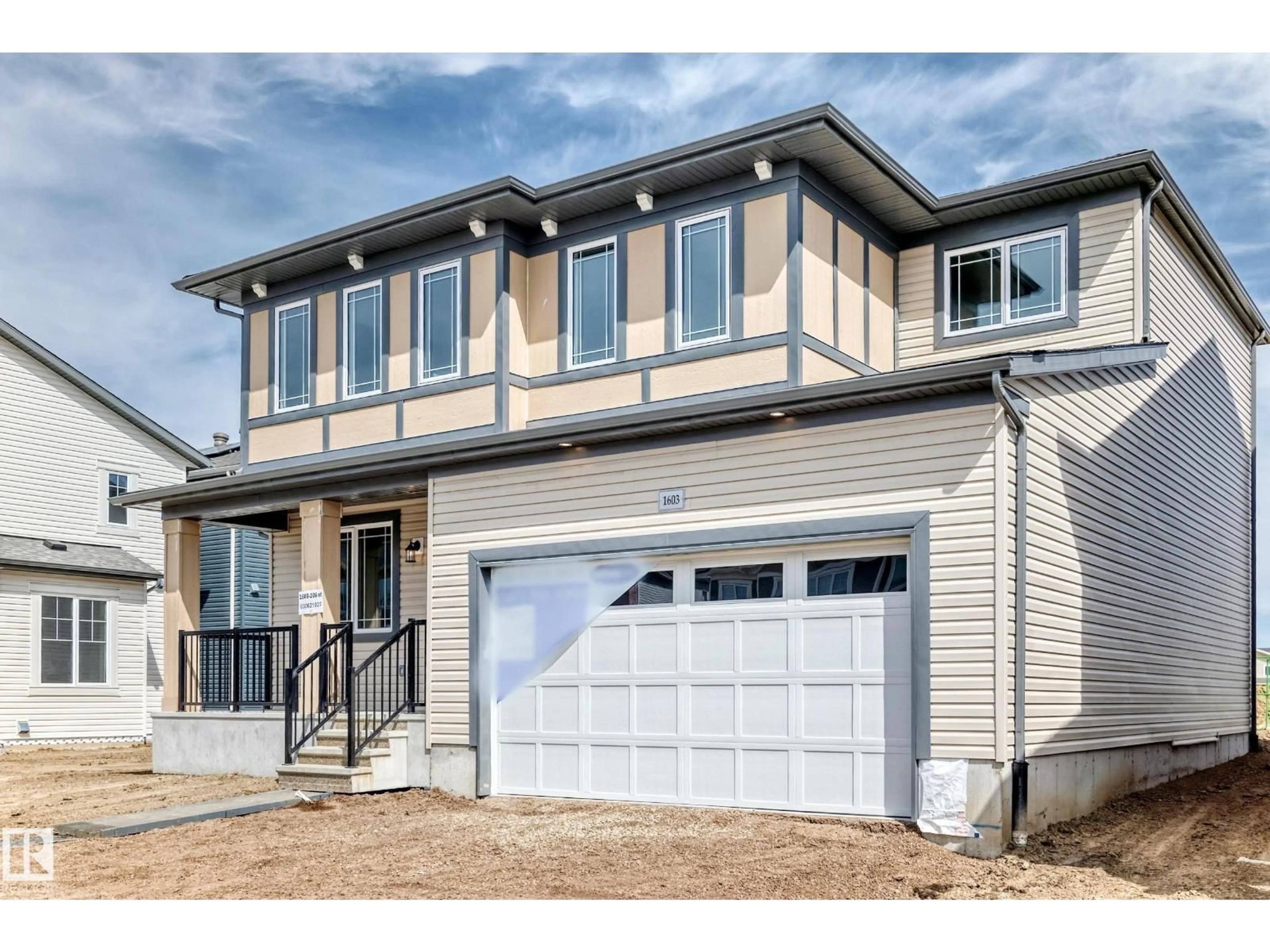 Home with vinyl exterior material, street for 1603 206 ST, Edmonton Alberta T6M3E7