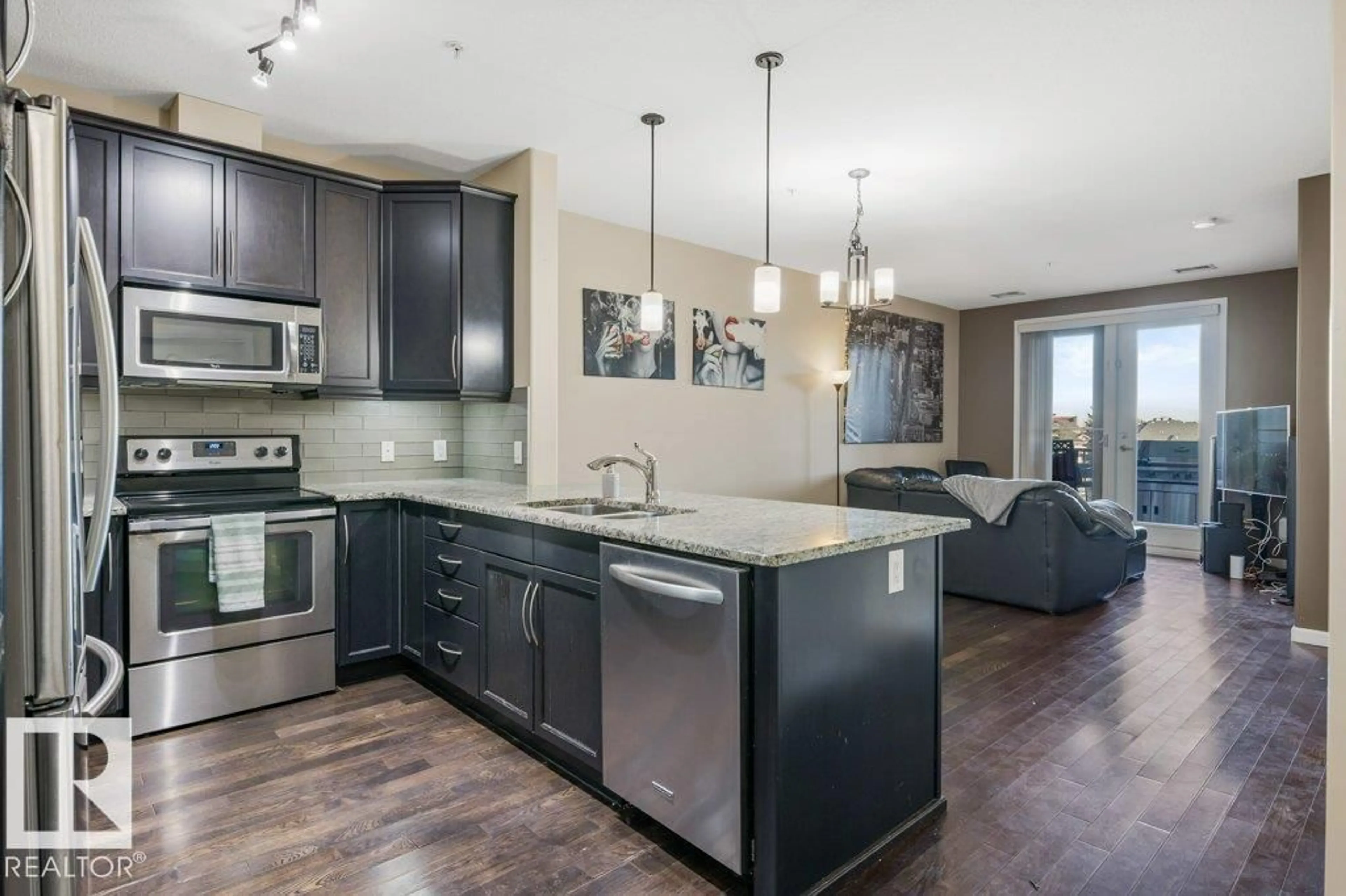 Open concept kitchen, unknown for 217 - 6083 MAYNARD WY, Edmonton Alberta T6R0S5