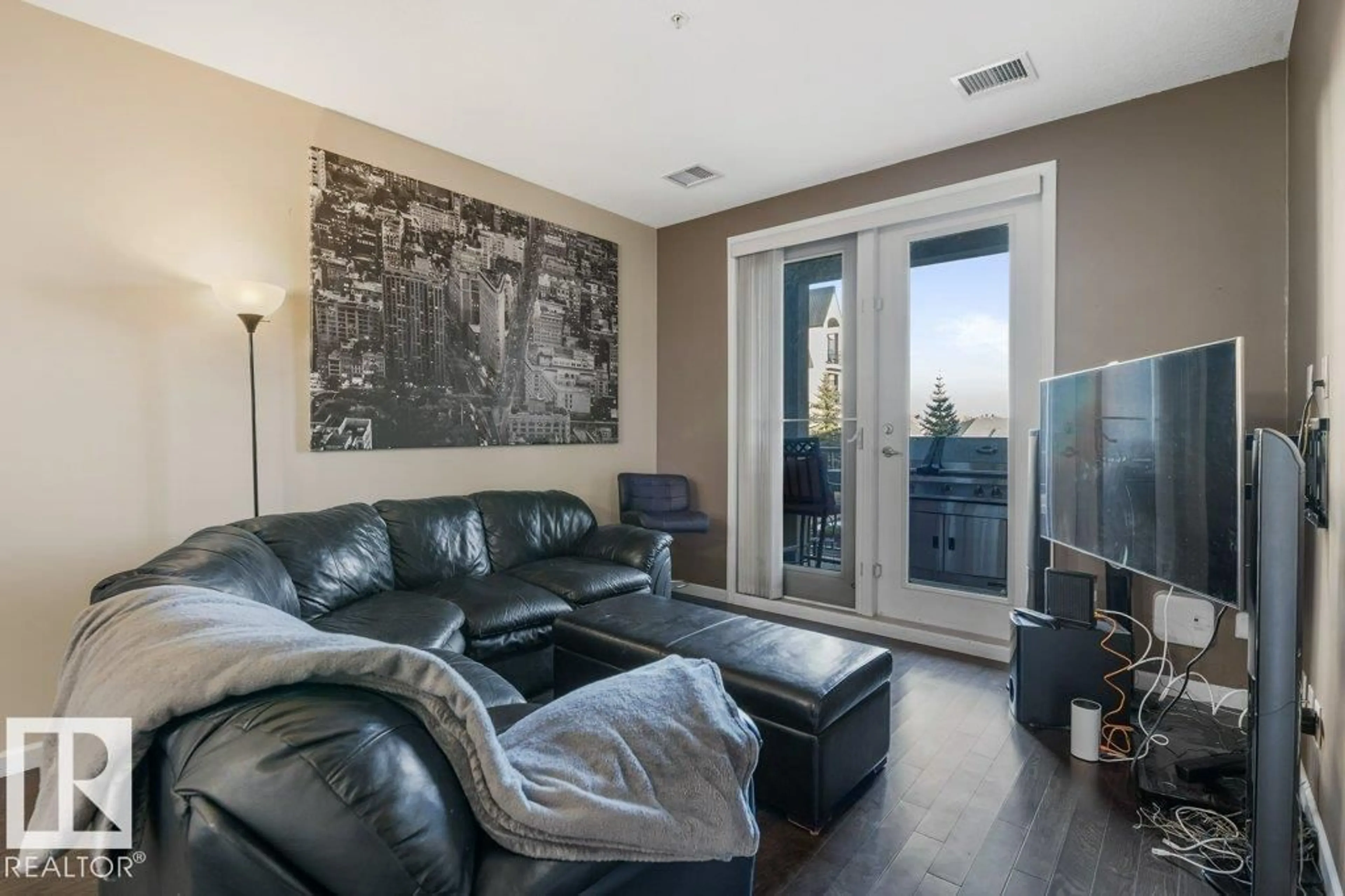Living room with furniture, unknown for 217 - 6083 MAYNARD WY, Edmonton Alberta T6R0S5