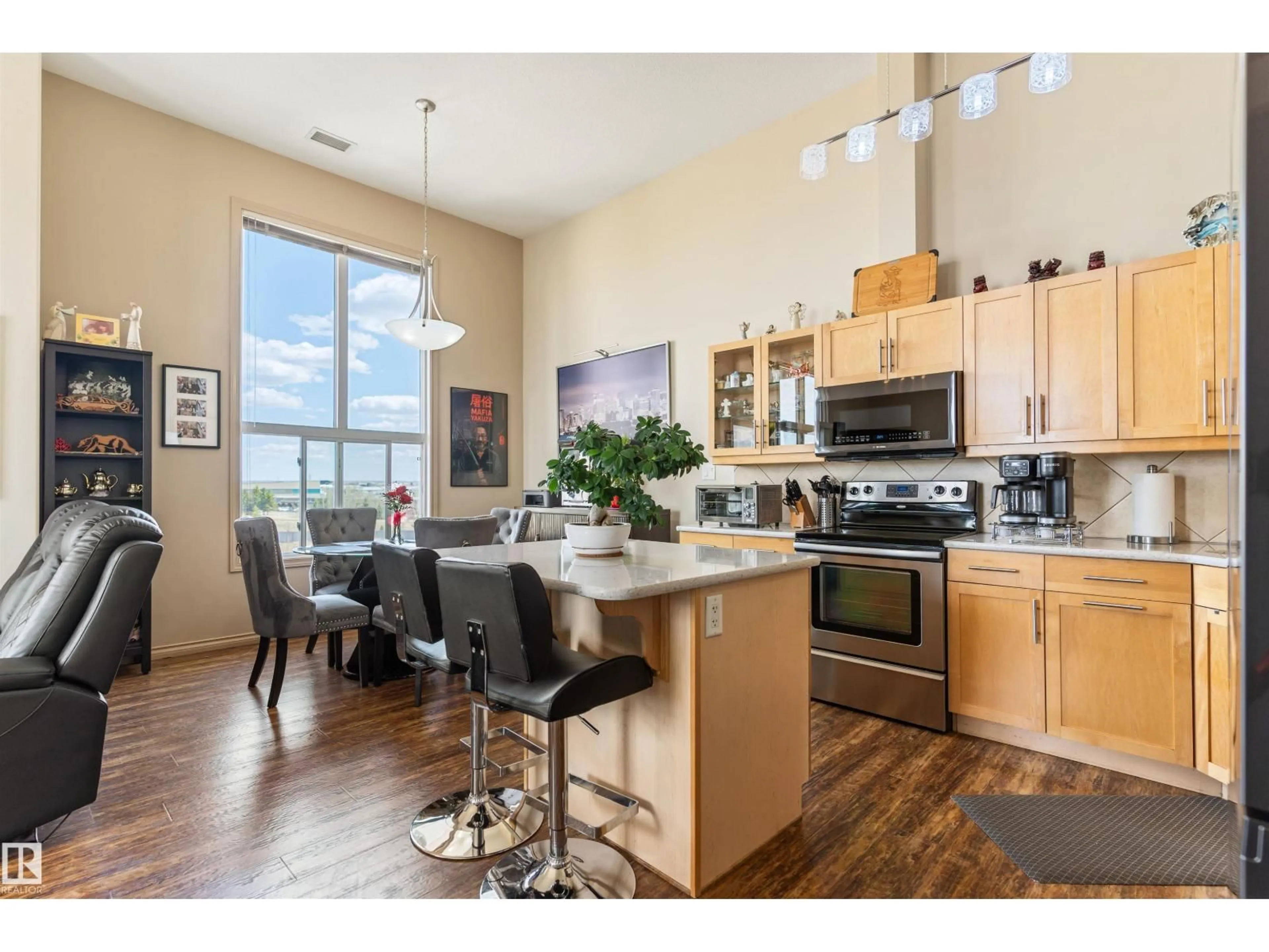 Open concept kitchen, wood/laminate floor for #419 - 7909 71 ST, Edmonton Alberta T6B3P5
