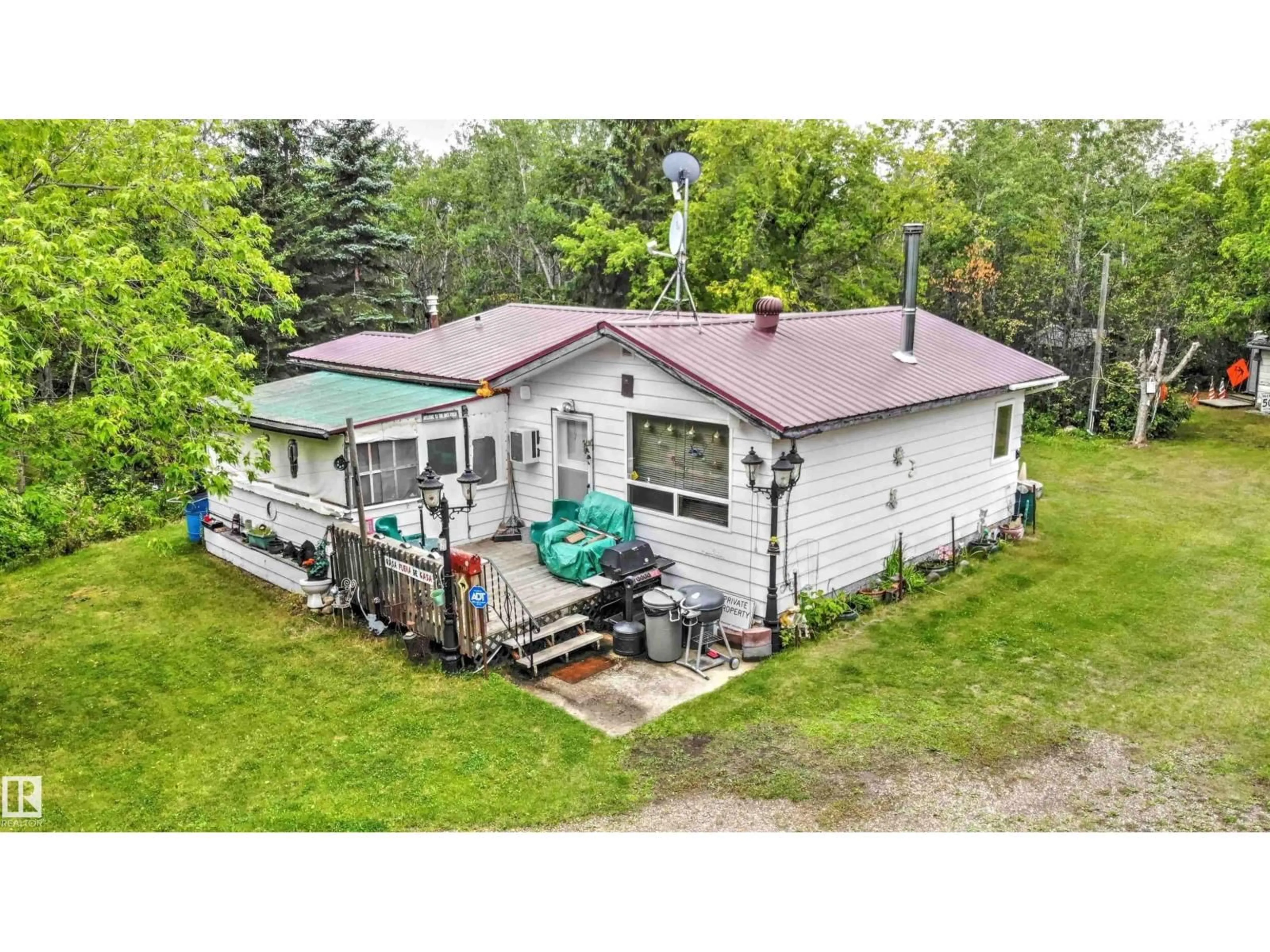 A pic from outside/outdoor area/front of a property/back of a property/a pic from drone, building for 26 - 562007 RR 113, Rural Two Hills County Alberta T0B4K0