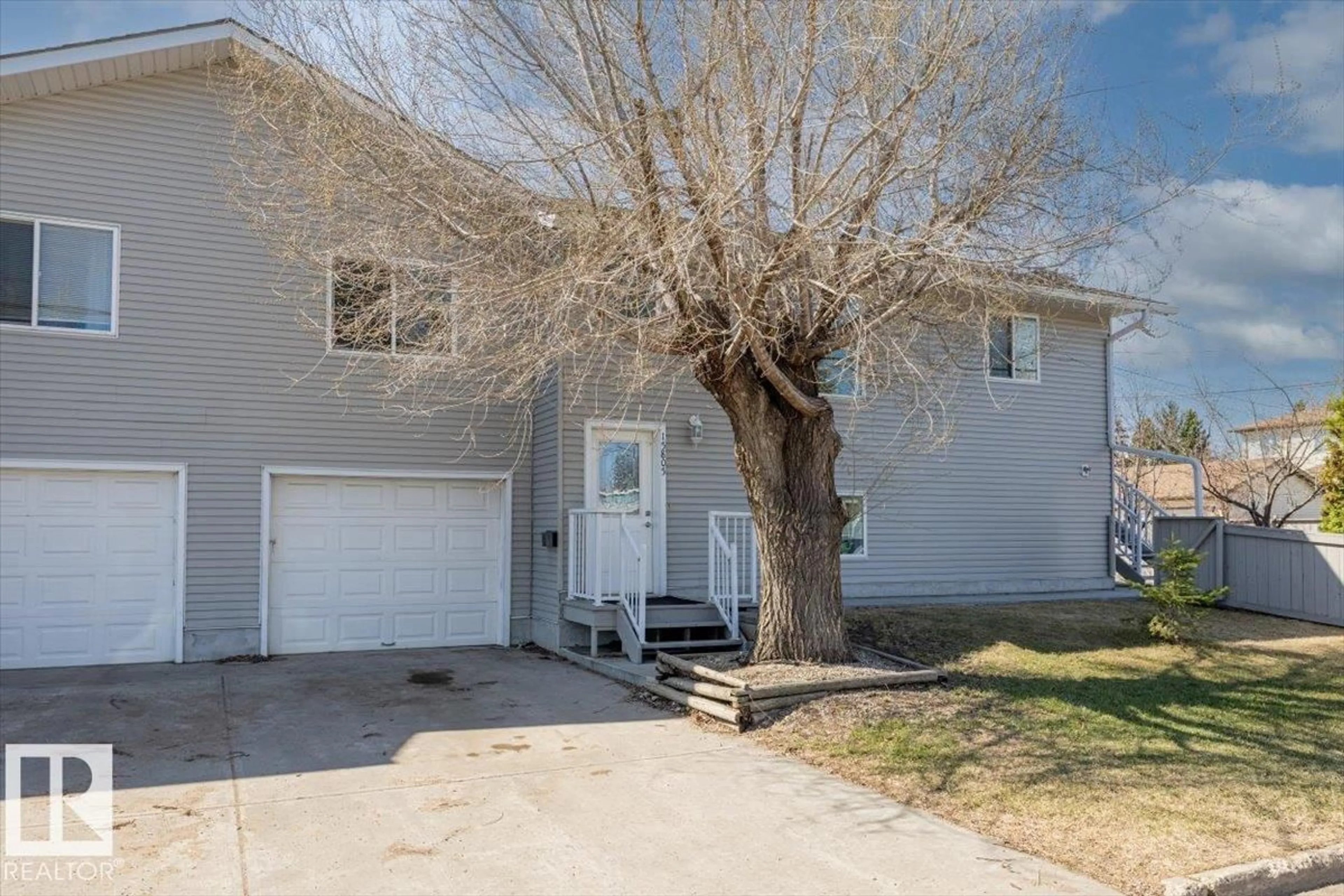 Home with vinyl exterior material, street for 15805 104 AV, Edmonton Alberta T5P2Y3