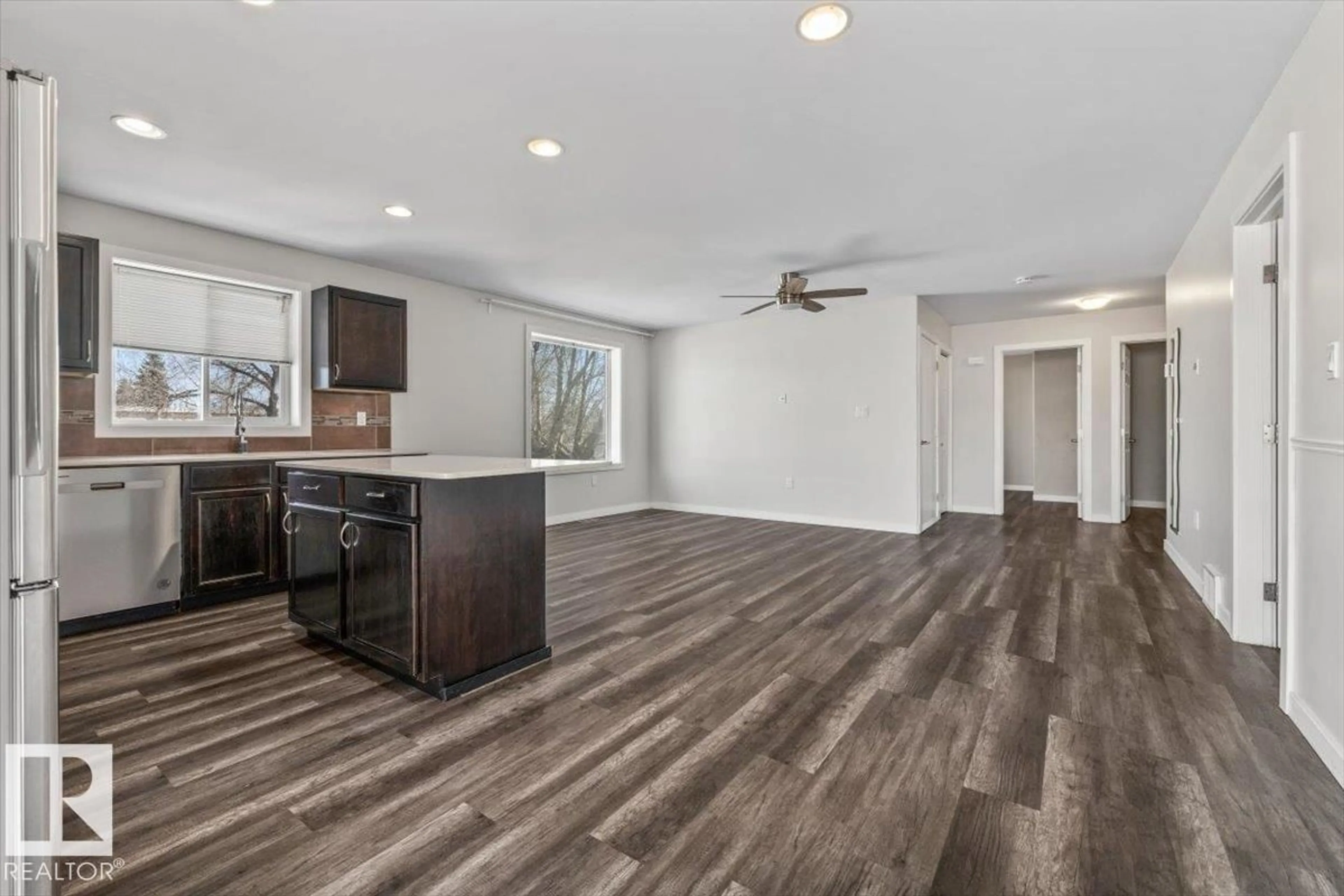 Open concept kitchen, wood/laminate floor for 15805 104 AV, Edmonton Alberta T5P2Y3
