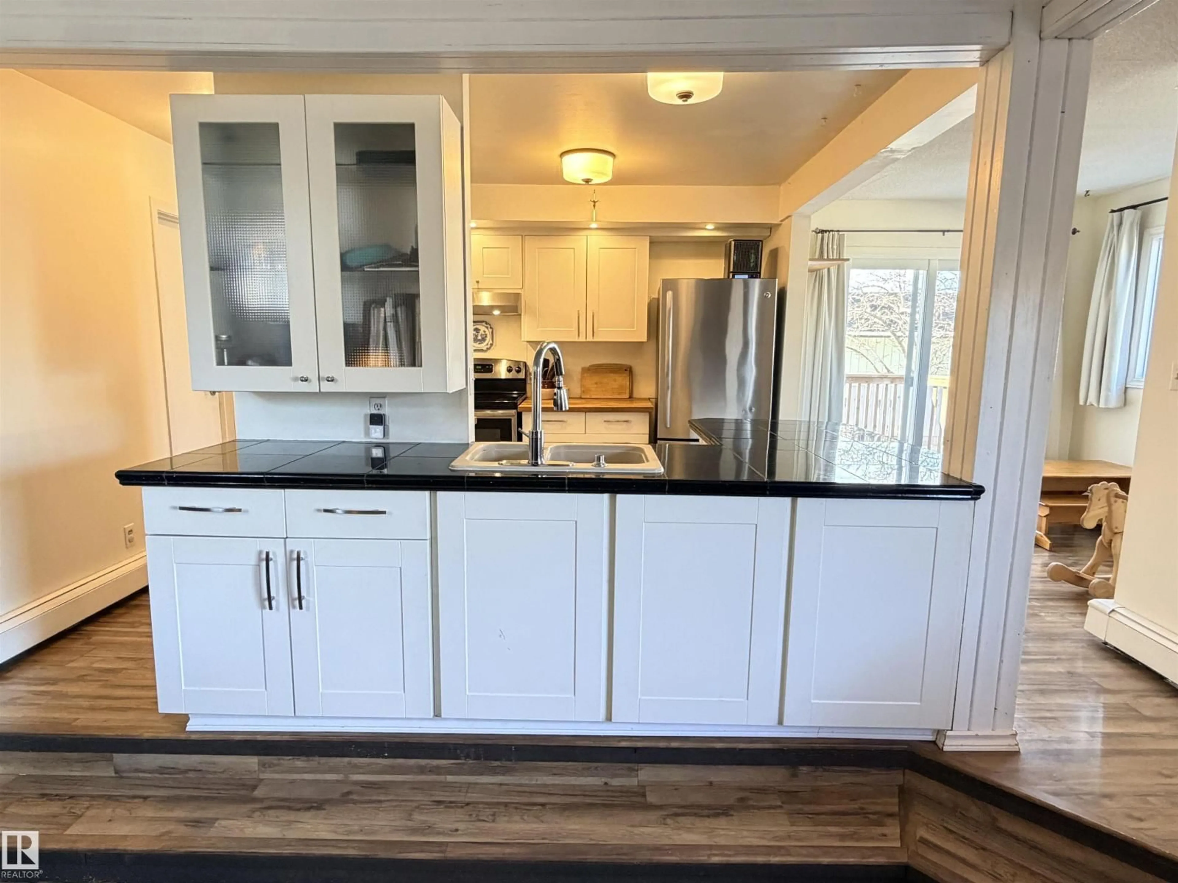 Open concept kitchen, wood/laminate floor for 10248 109 AV, Westlock Alberta T7P1H1