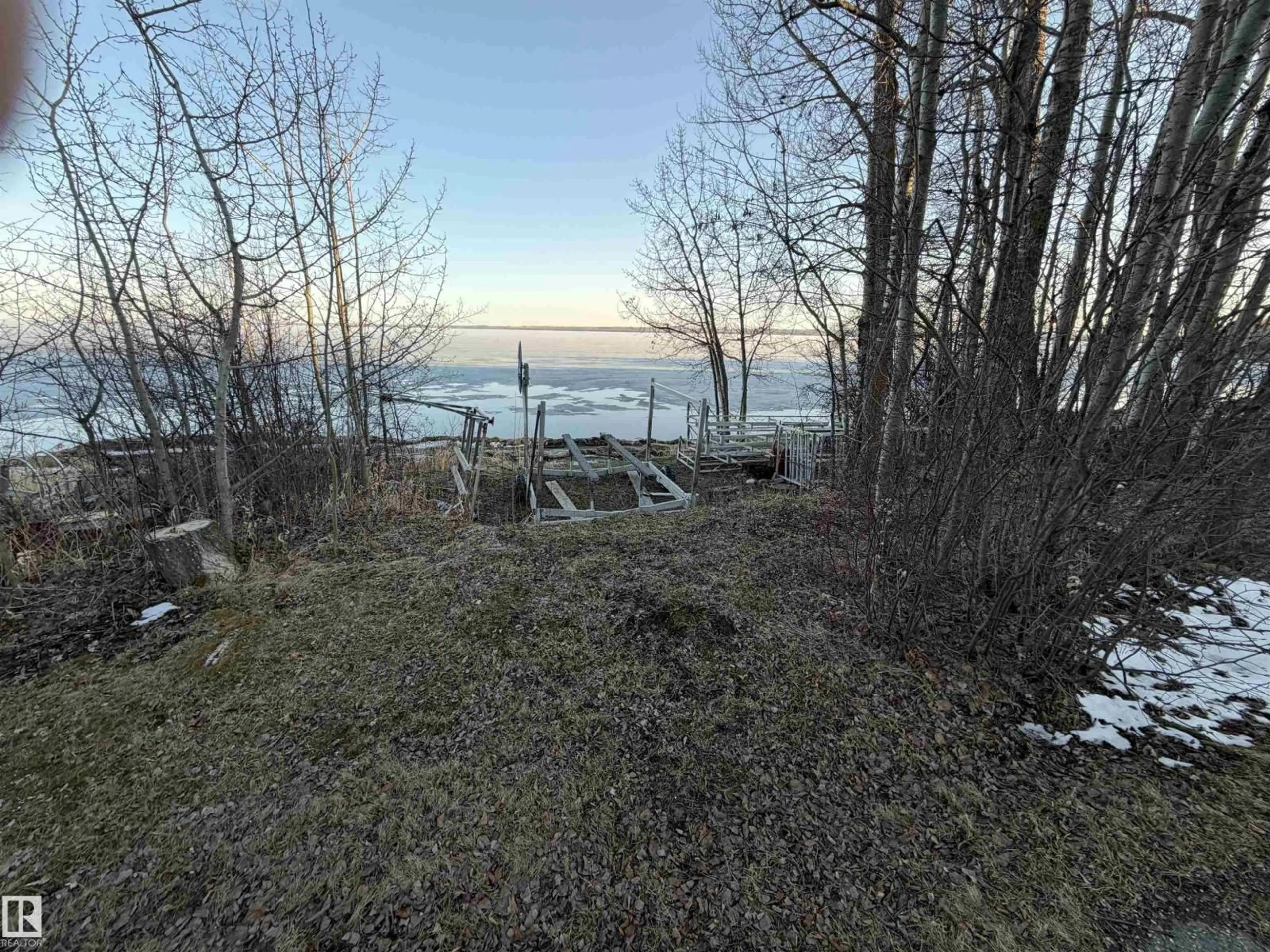 A pic from outside/outdoor area/front of a property/back of a property/a pic from drone, water/lake/river/ocean view for 200 - 47436 RGE RD, Rural Leduc County Alberta T0C2C0