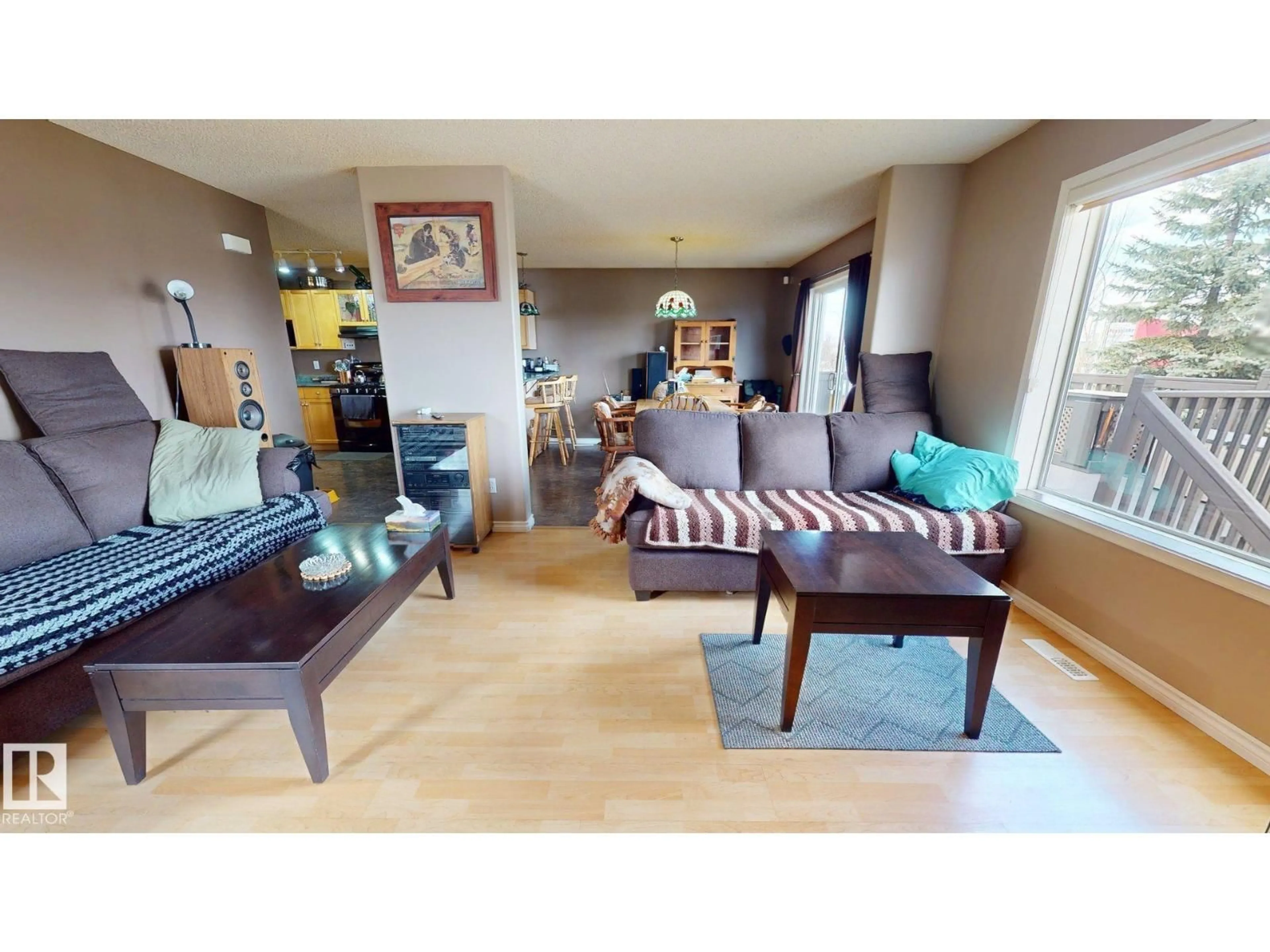 Living room with furniture, wood/laminate floor for 548 WISEMAN LN, Edmonton Alberta T6T1N7