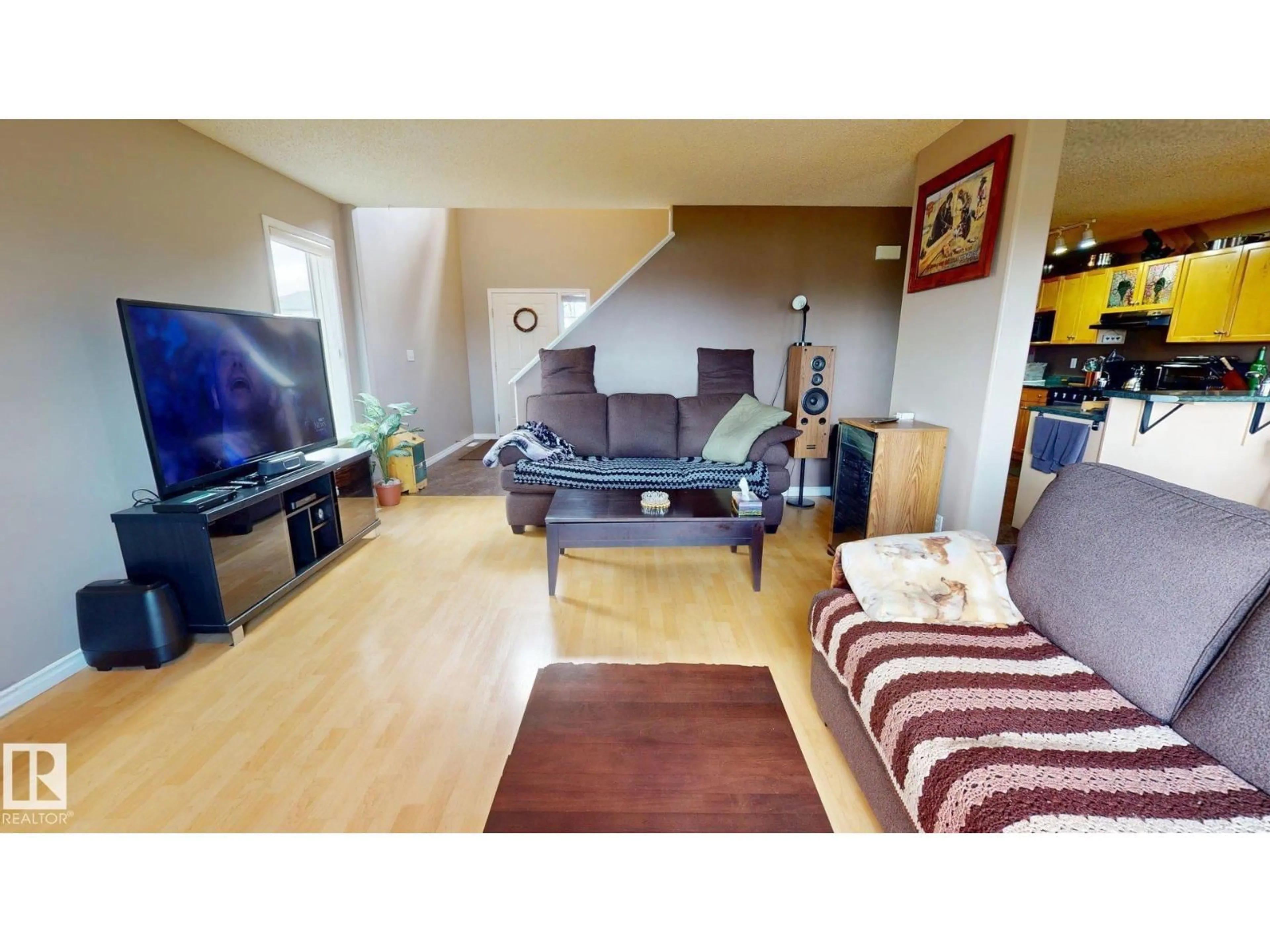 Living room with furniture, wood/laminate floor for 548 WISEMAN LN, Edmonton Alberta T6T1N7