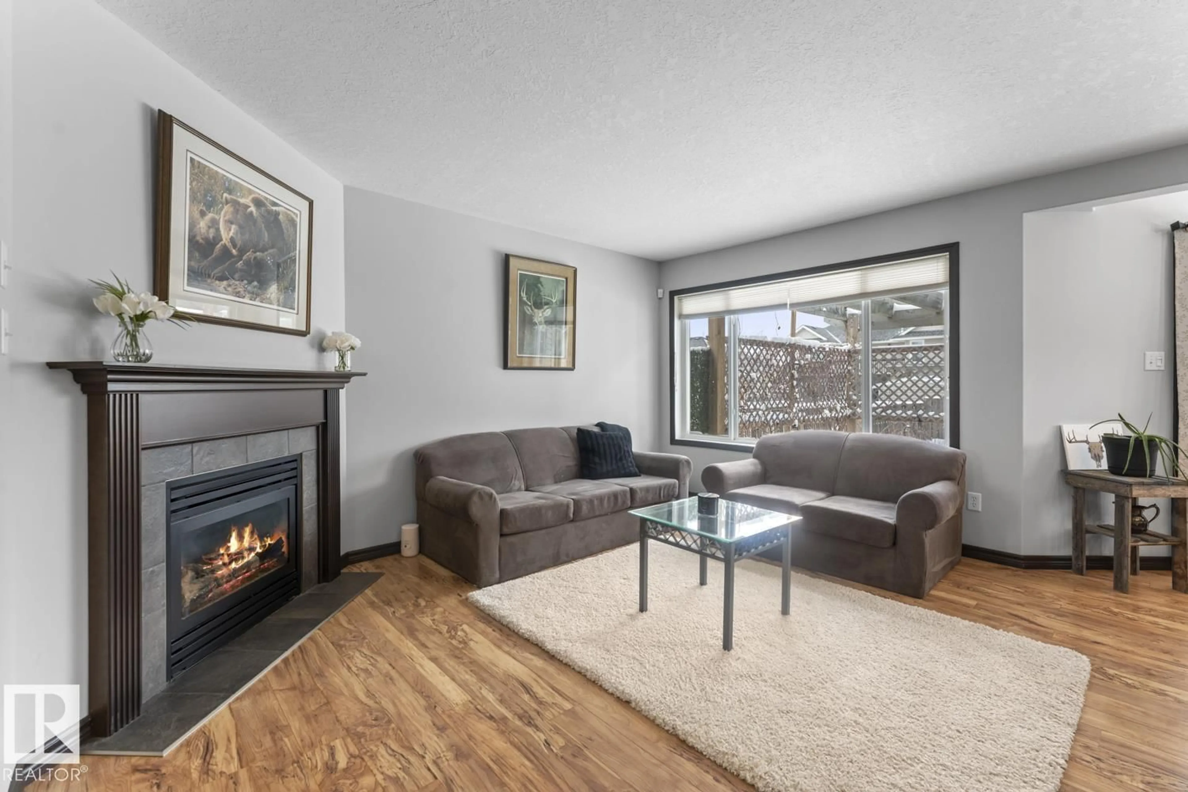 Living room with furniture, wood/laminate floor for 2609 LAKE AV, Cold Lake Alberta T9M0A1