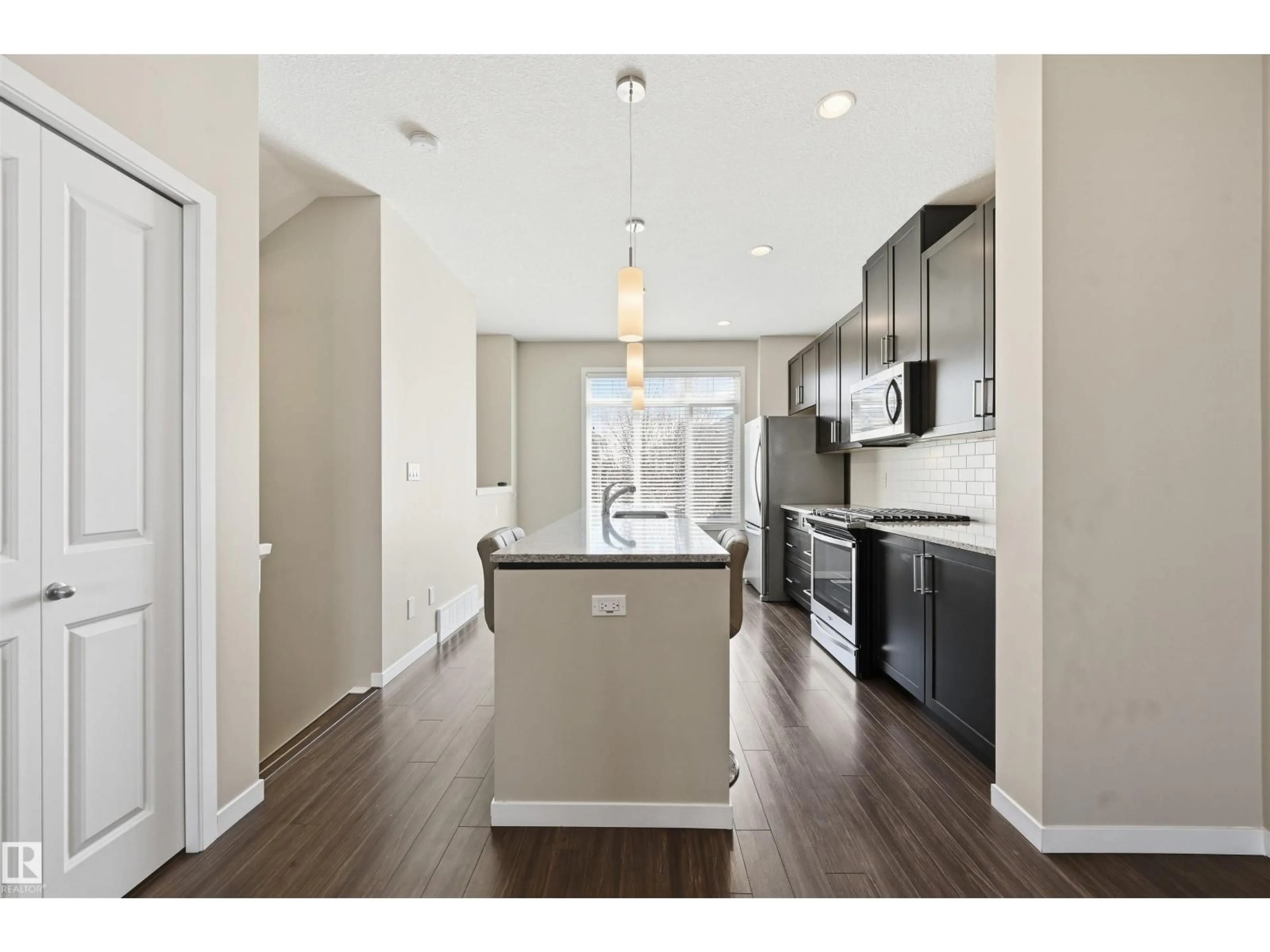 Open concept kitchen, unknown for #4 - 320 SECORD BV, Edmonton Alberta T5T7E8