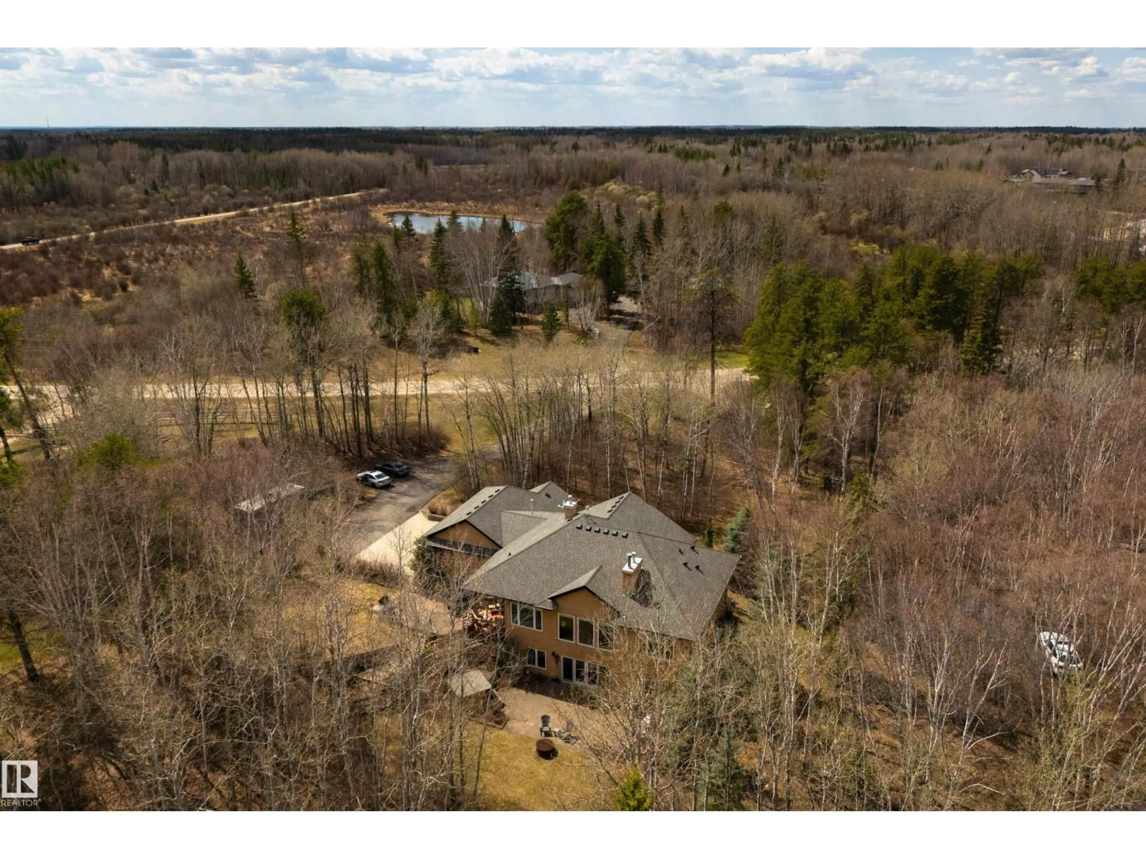 A pic from outside/outdoor area/front of a property/back of a property/a pic from drone, water/lake/river/ocean view for #7 - 26516 TWP ROAD 514, Rural Parkland County Alberta T7Y1E9