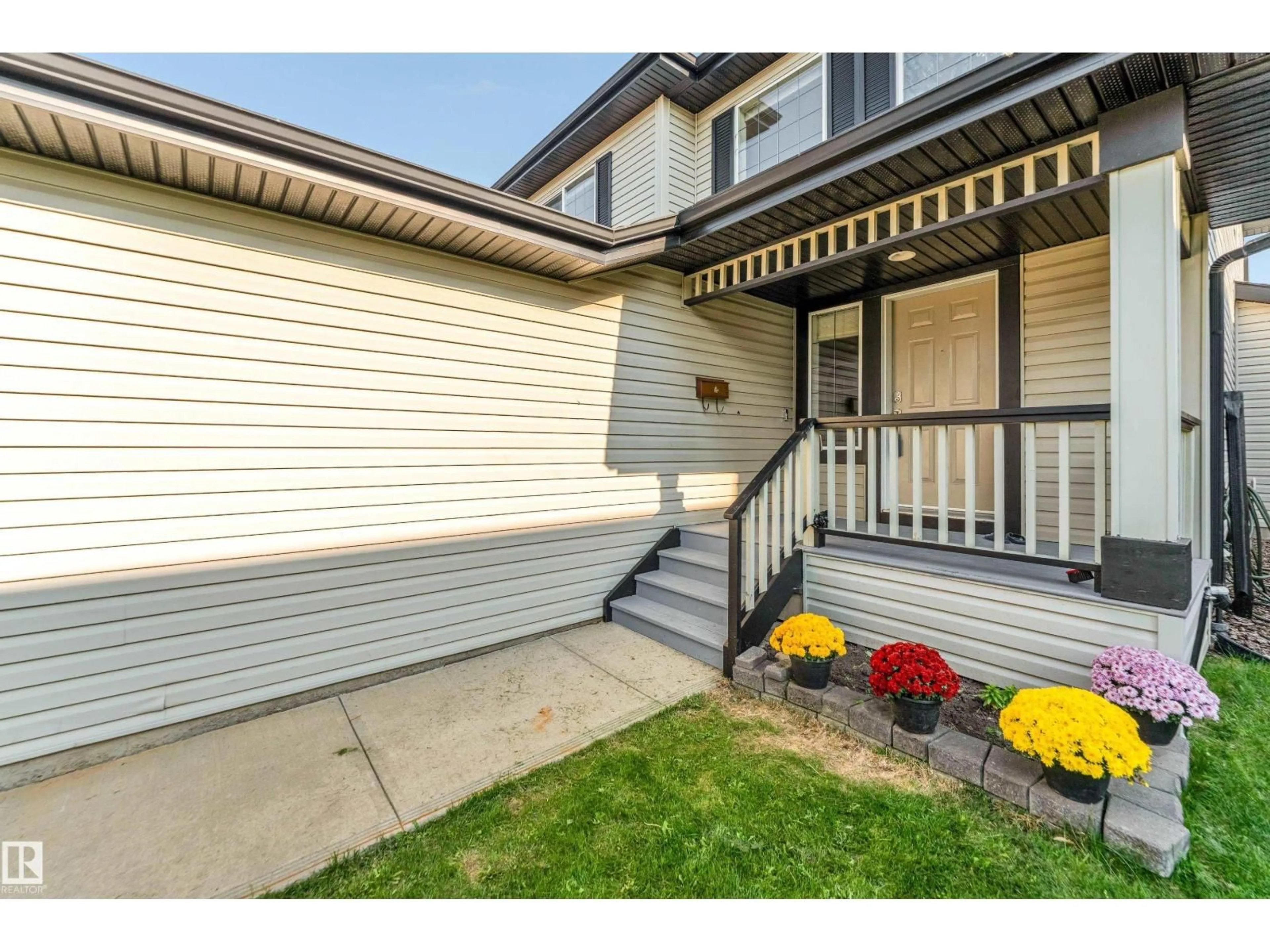 Home with vinyl exterior material, street for 10621 175A AV, Edmonton Alberta T5X6C1