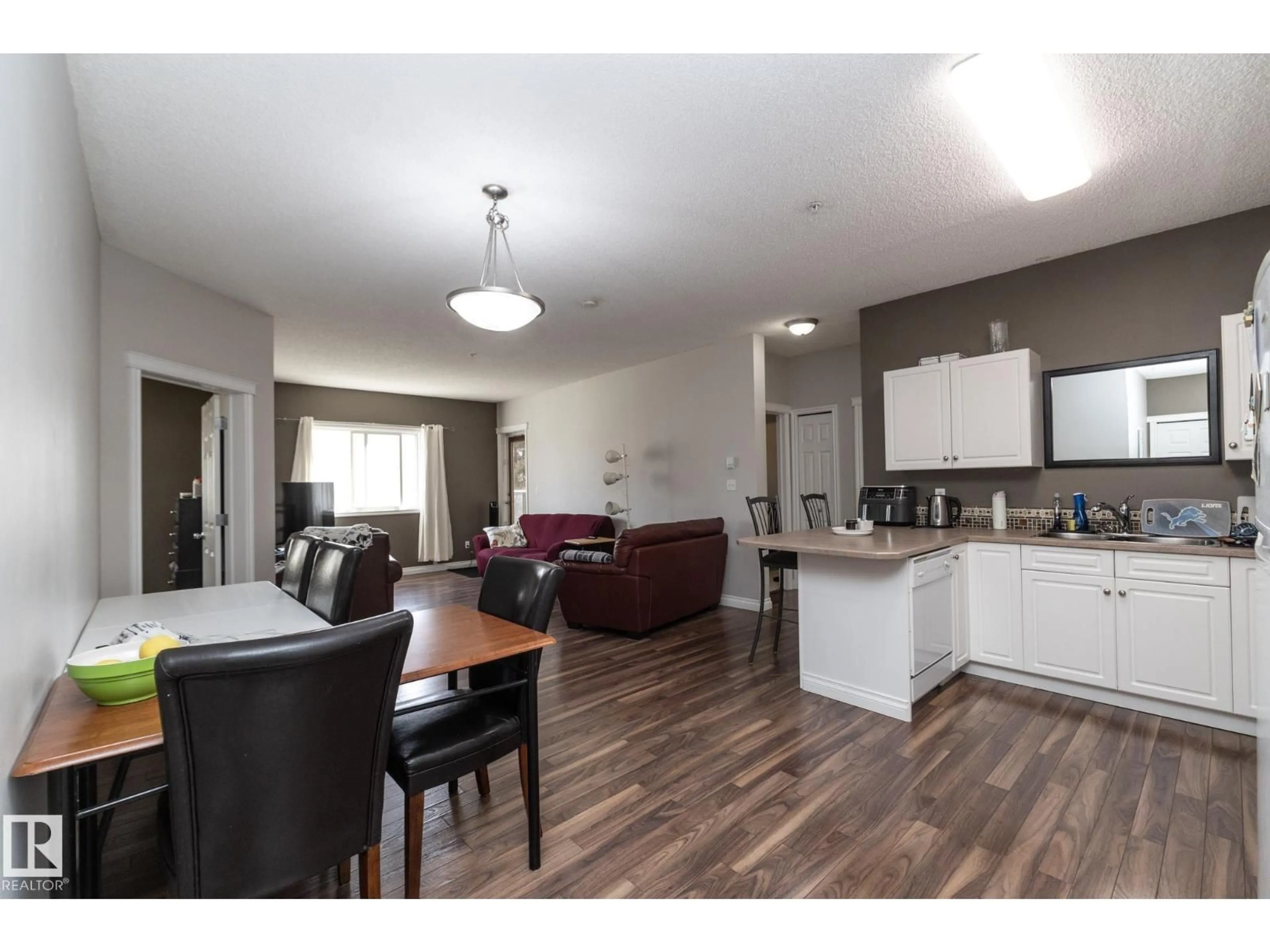Open concept kitchen, wood/laminate floor for #102 - 304 LEWIS ESTATES BV, Edmonton Alberta T5T6Y7