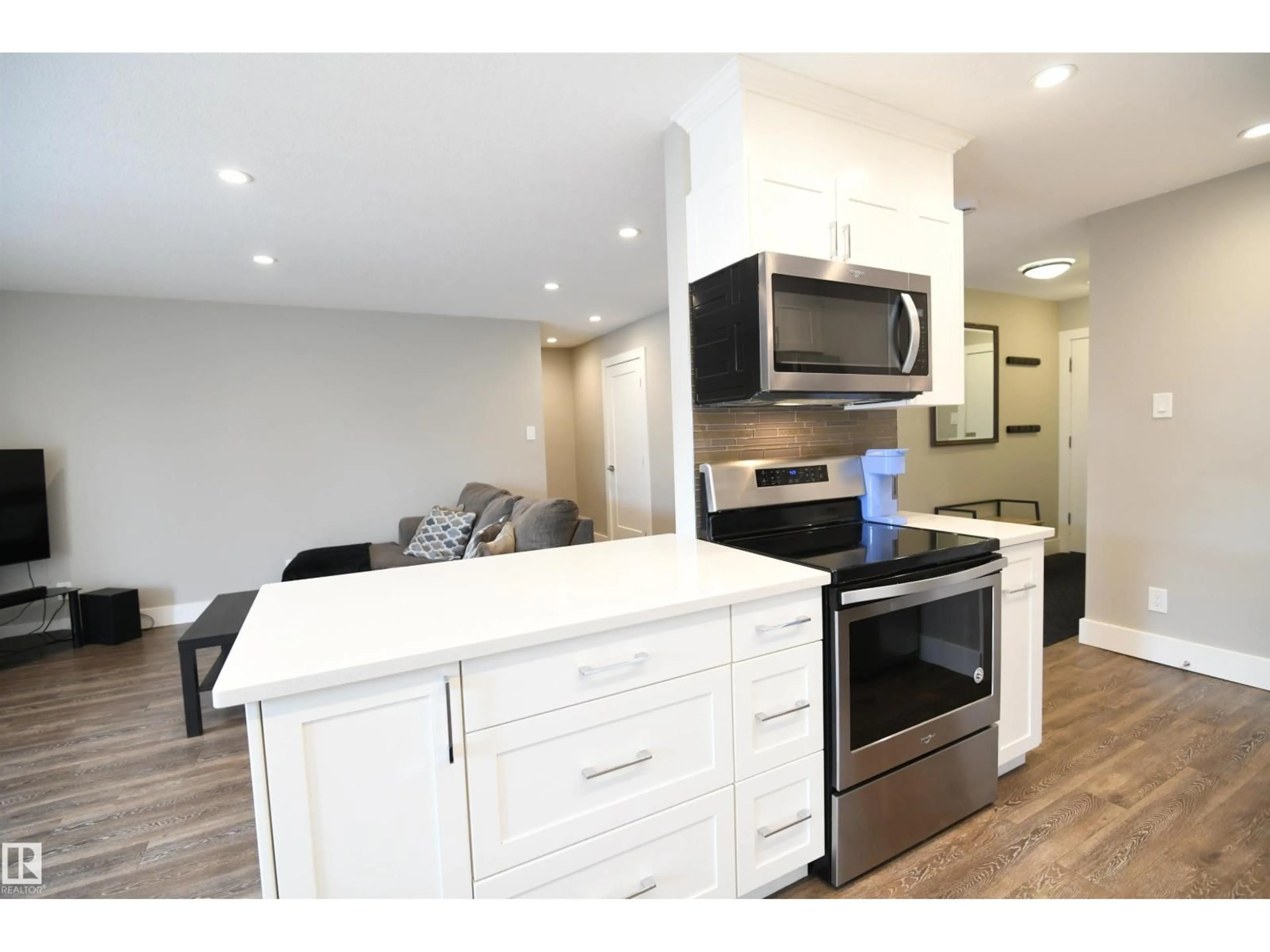 Open concept kitchen, wood/laminate floor for 206 - 8125 110 ST NW, Edmonton Alberta T6G2P3