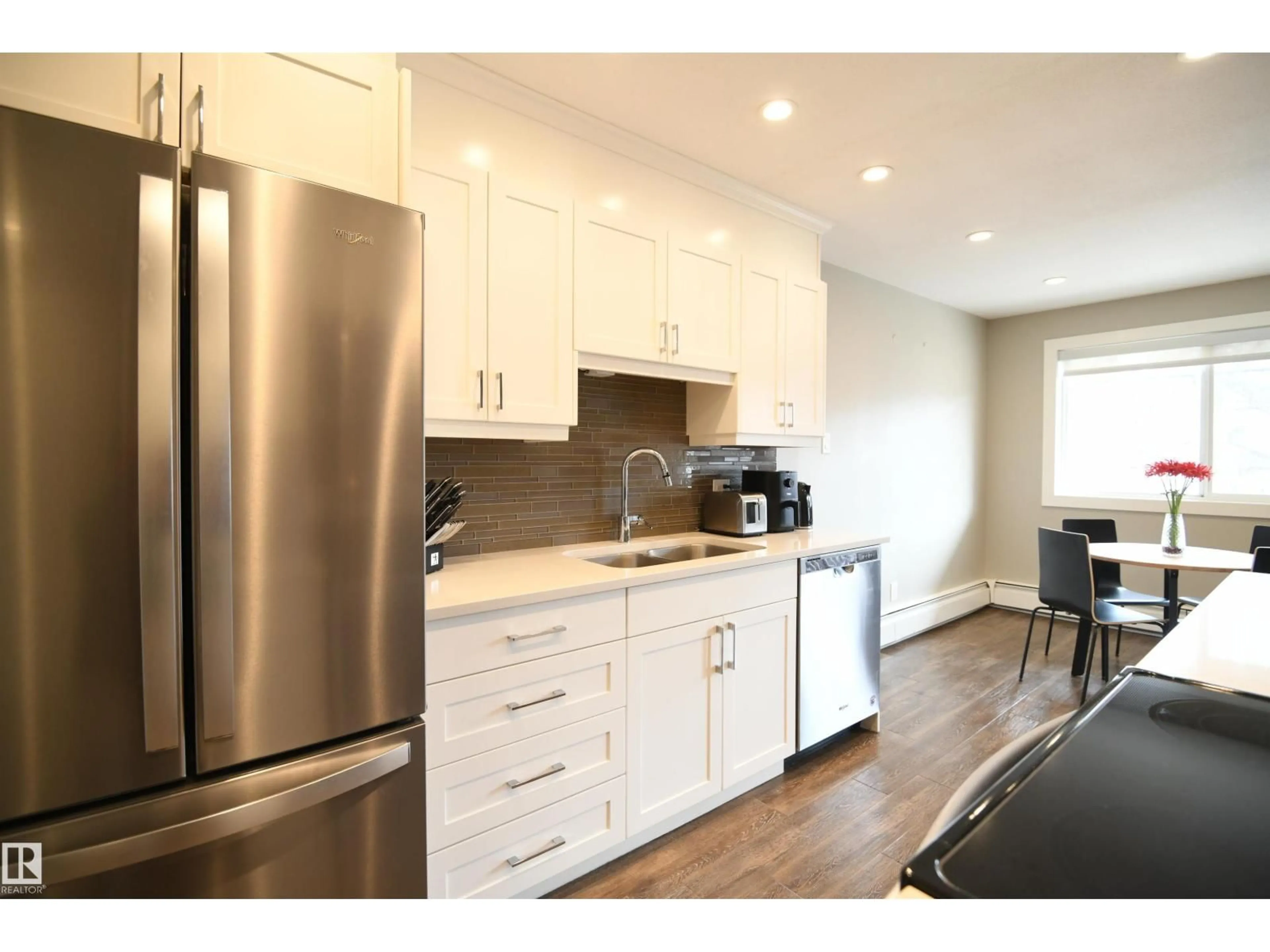Open concept kitchen, wood/laminate floor for 206 - 8125 110 ST NW, Edmonton Alberta T6G2P3
