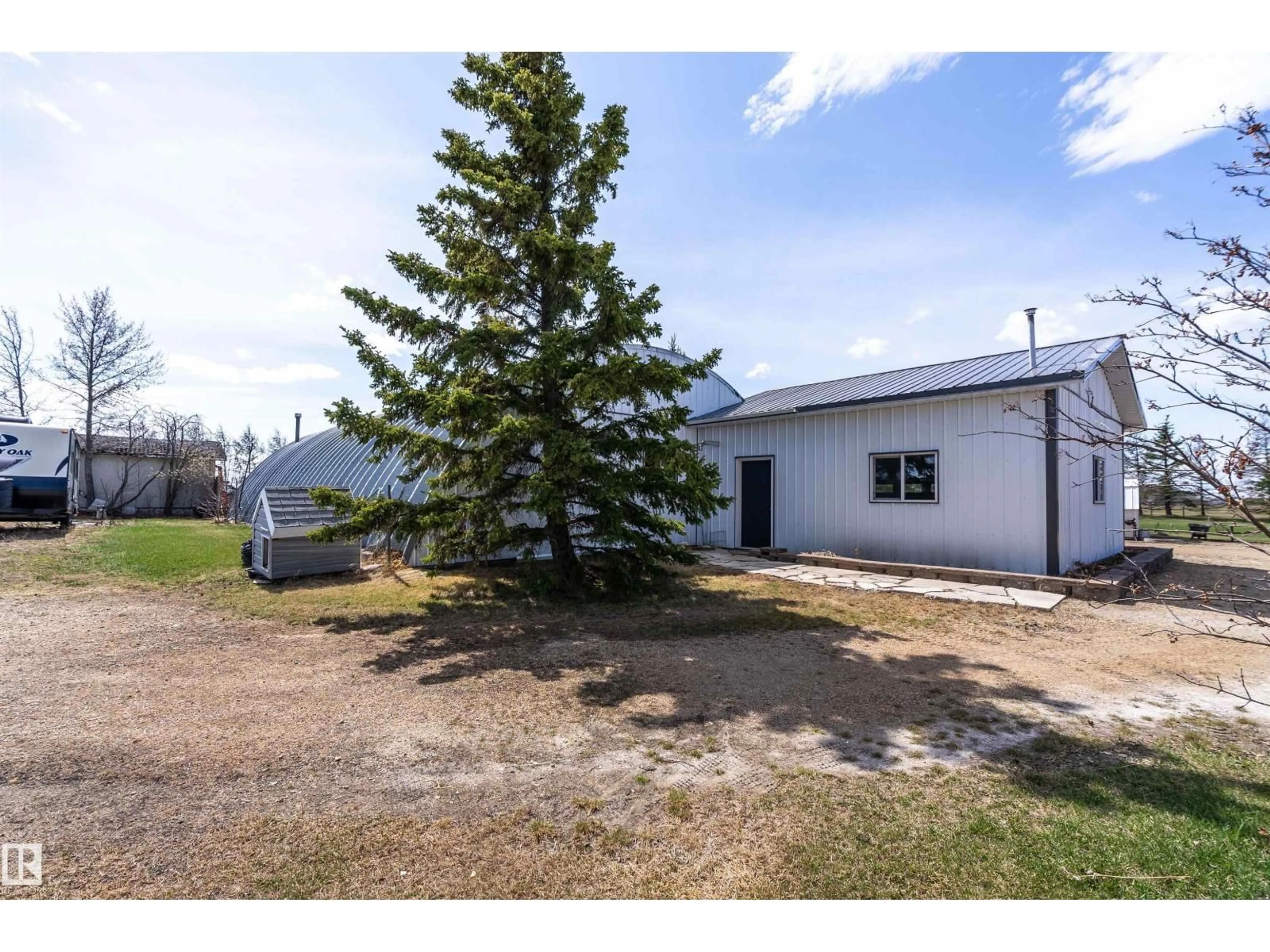A pic from outside/outdoor area/front of a property/back of a property/a pic from drone, unknown for 25057 TWP RD, Rural Leduc County Alberta T4X2N5