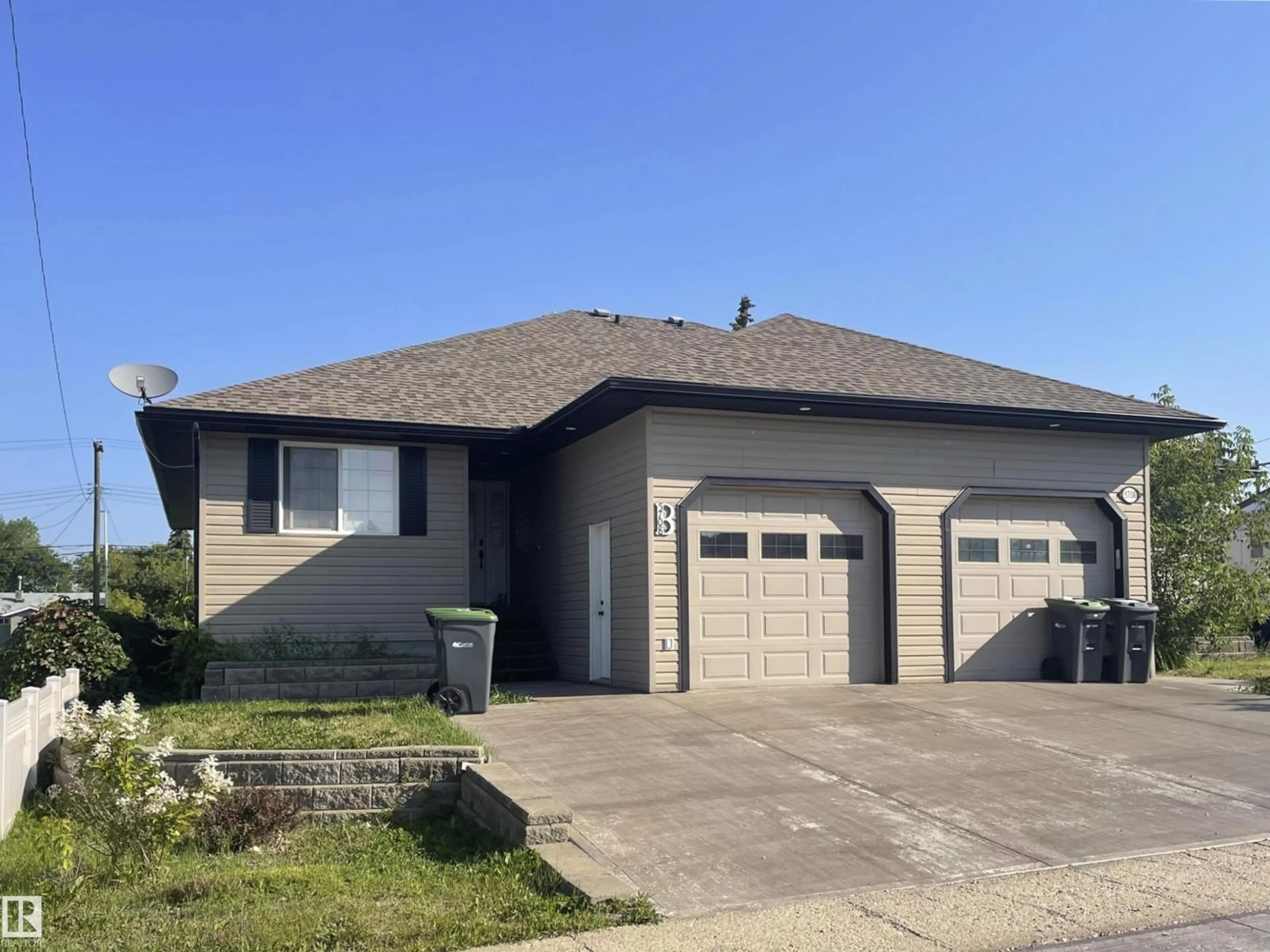 Home with vinyl exterior material, street for B - 5708 51 AV, Cold Lake Alberta T9M1S4
