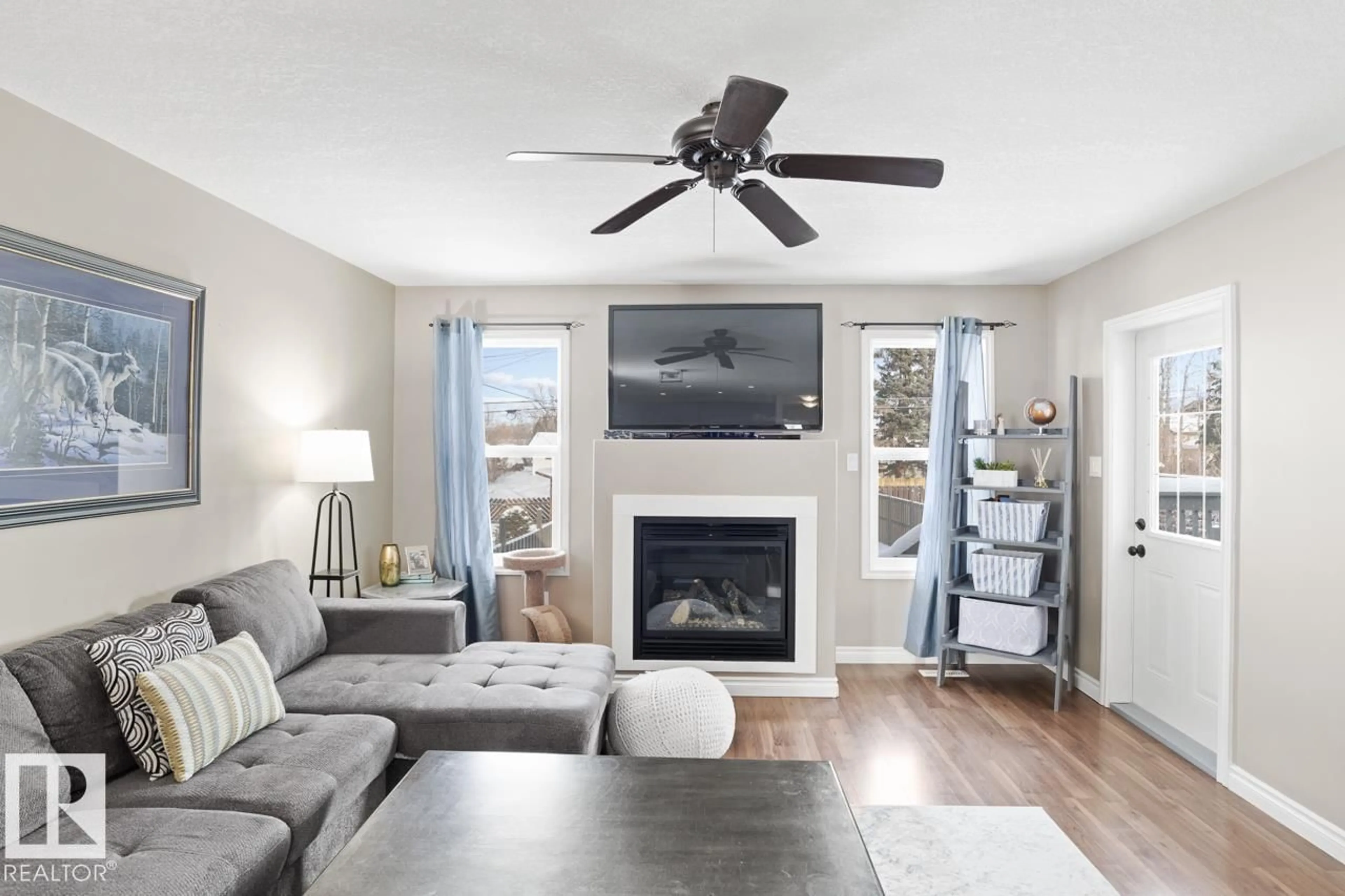 Living room with furniture, wood/laminate floor for B - 5708 51 AV, Cold Lake Alberta T9M1S4