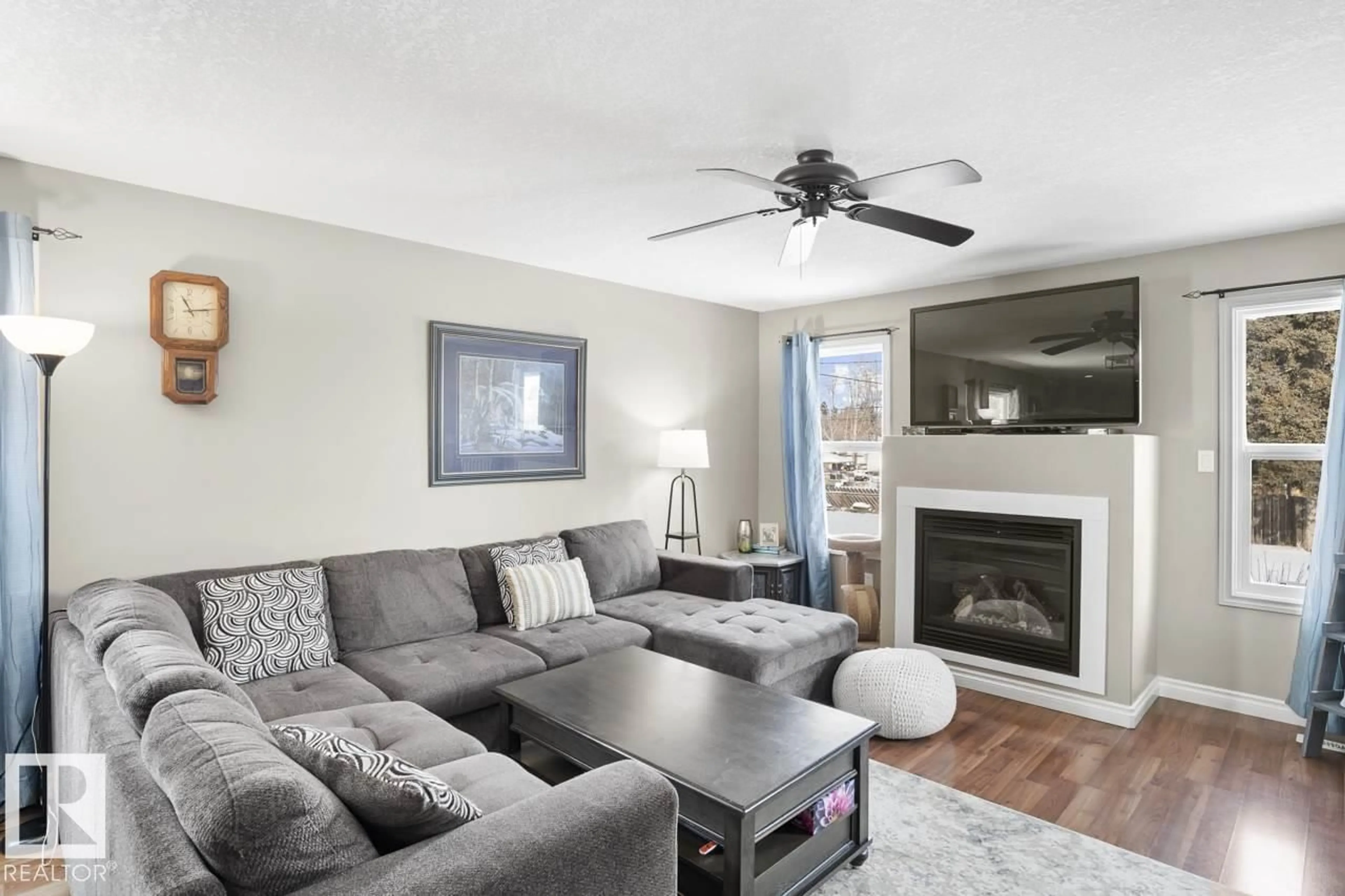 Living room with furniture, wood/laminate floor for B - 5708 51 AV, Cold Lake Alberta T9M1S4