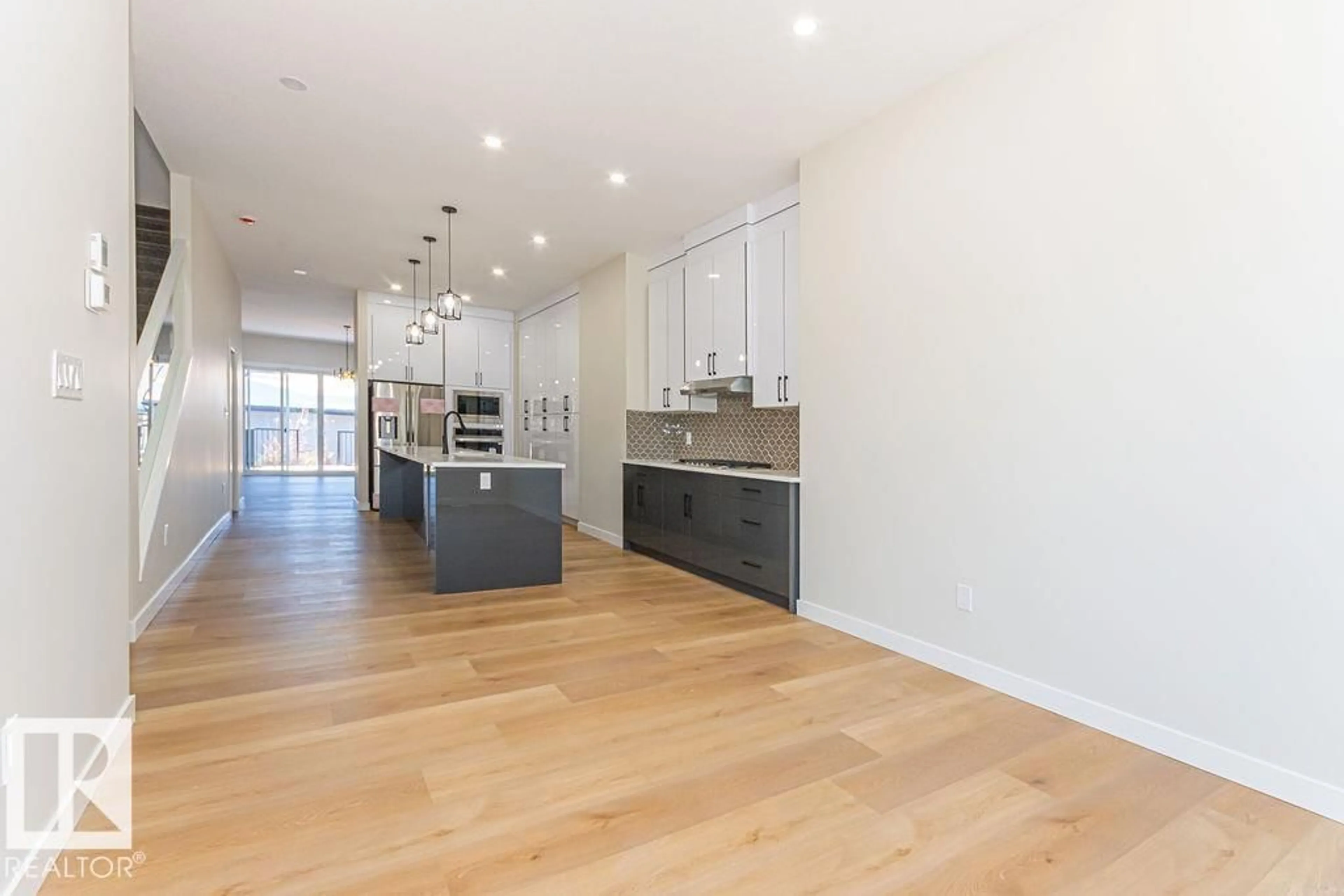 Open concept kitchen, wood/laminate floor for NW - 9814 155 ST, Edmonton Alberta T5P2K9