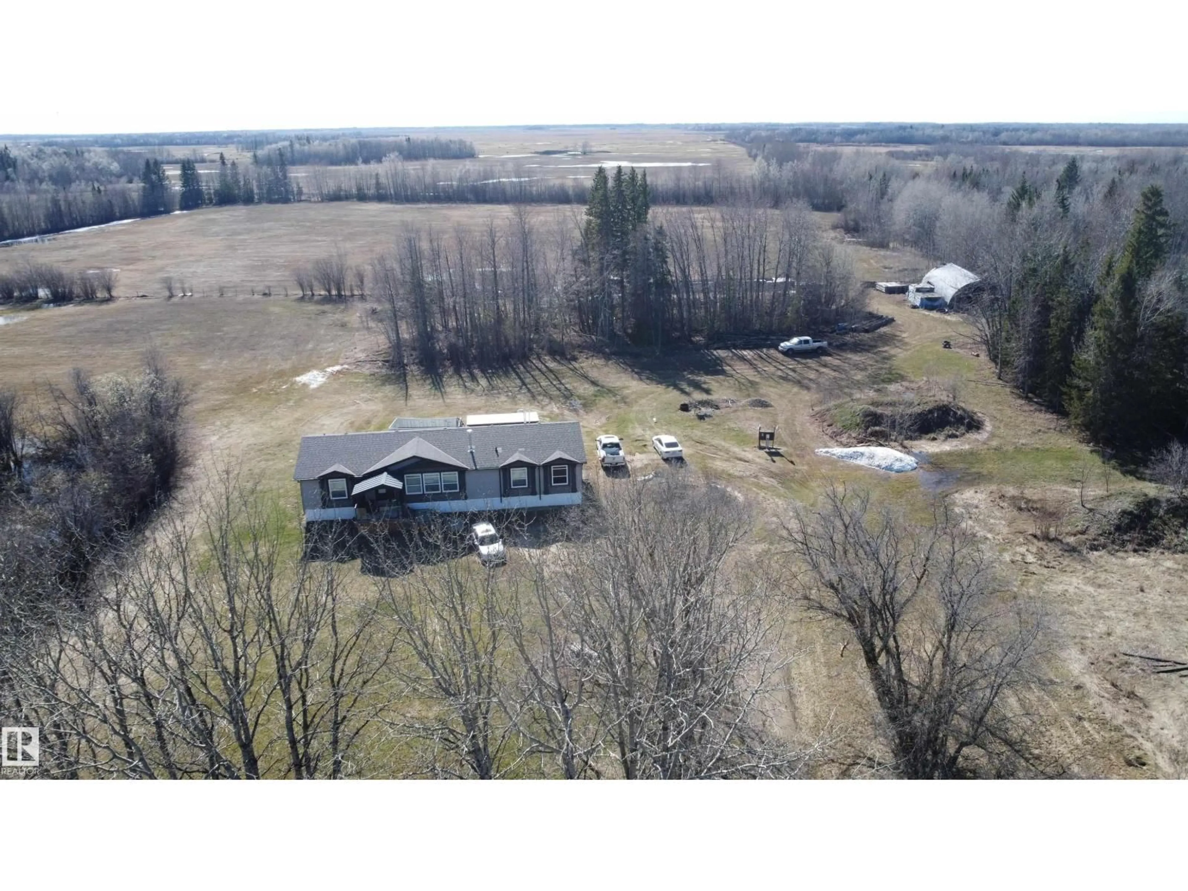 A pic from outside/outdoor area/front of a property/back of a property/a pic from drone, water/lake/river/ocean view for 61516 RG RD 204, Rural Thorhild County Alberta T0A2P0