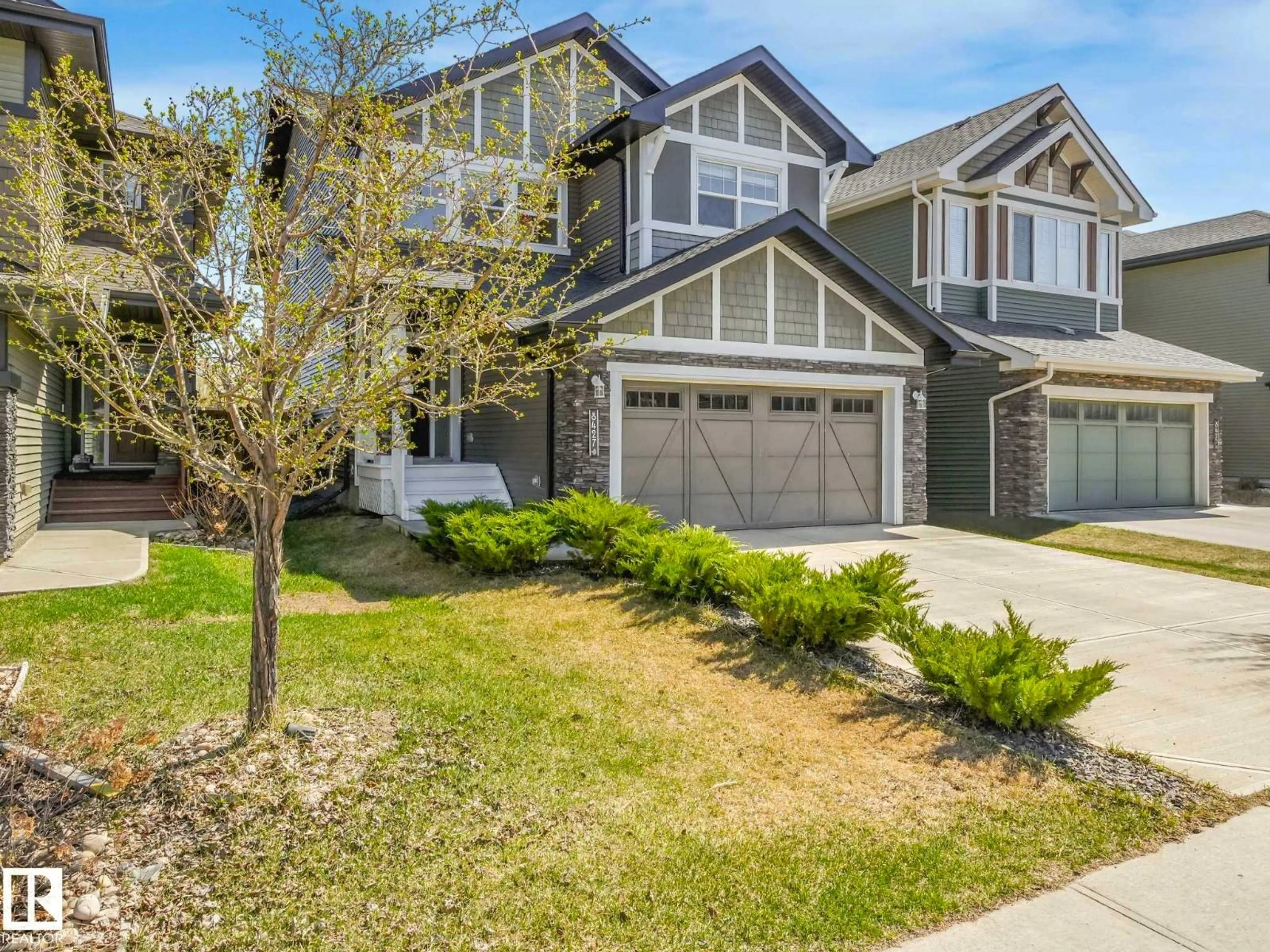 Home with vinyl exterior material, street for NW - 8427 216 ST, Edmonton Alberta T5T4W2