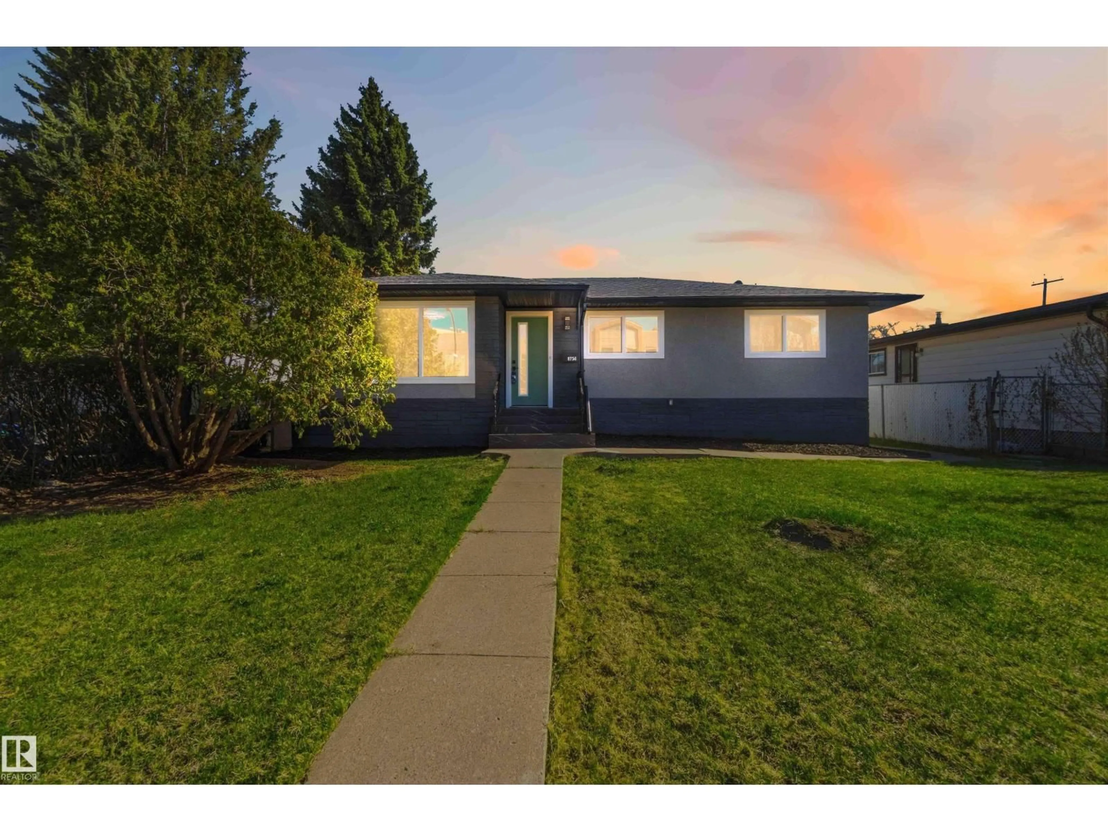 Home with vinyl exterior material, street for 8736 66 AV, Edmonton Alberta T6E0L3