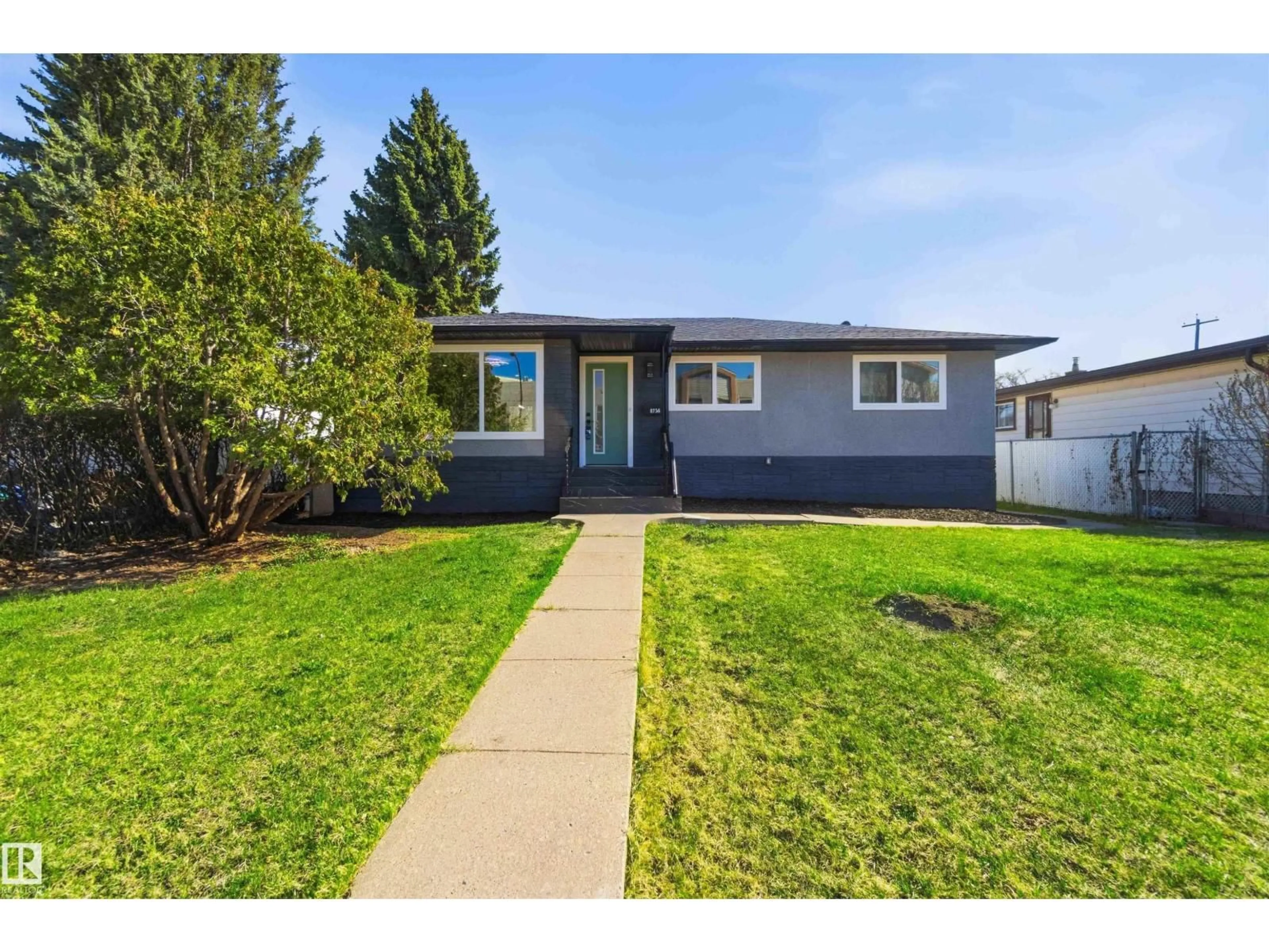 Home with vinyl exterior material, street for 8736 66 AV, Edmonton Alberta T6E0L3