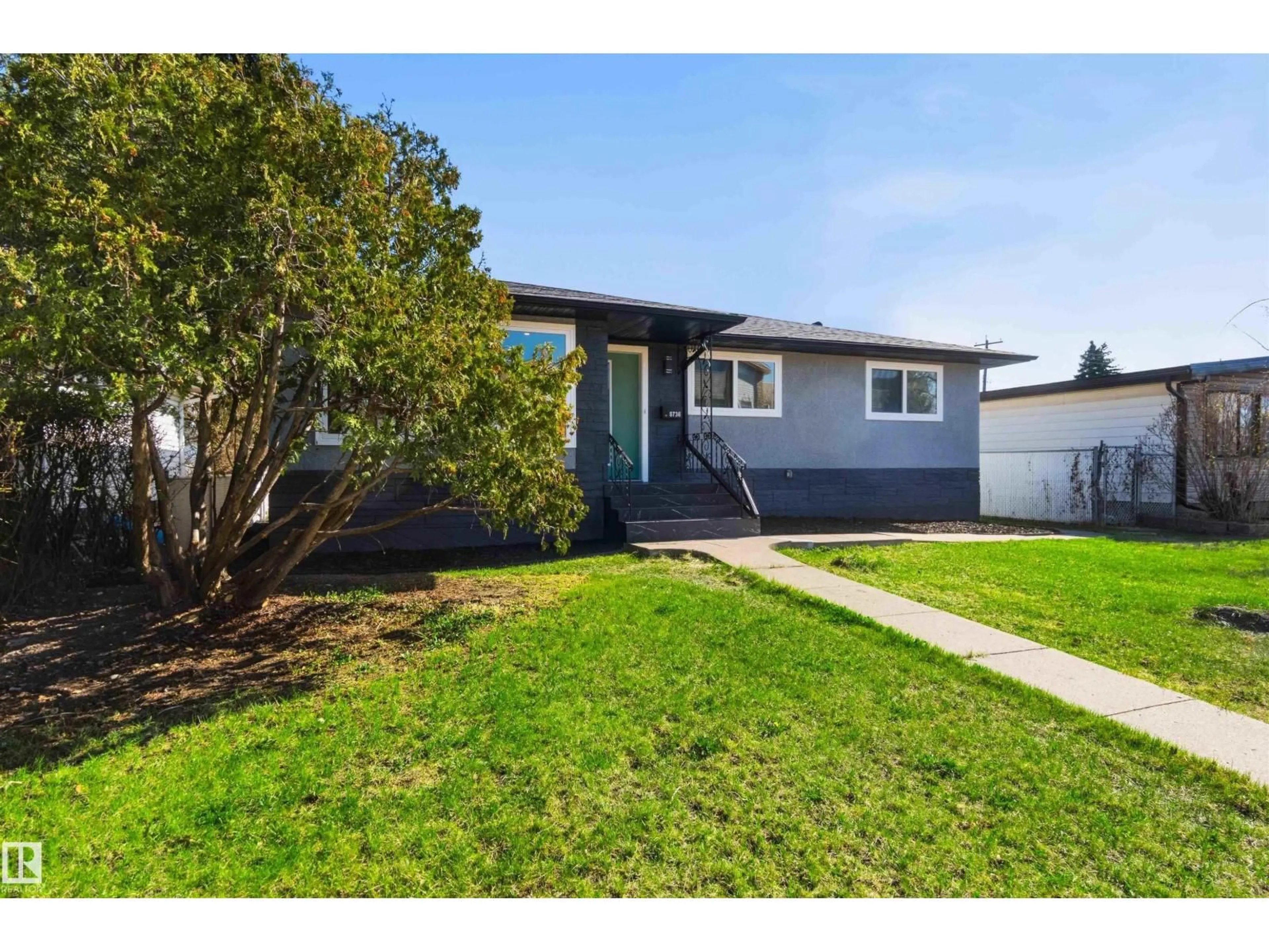Home with vinyl exterior material, street for 8736 66 AV, Edmonton Alberta T6E0L3