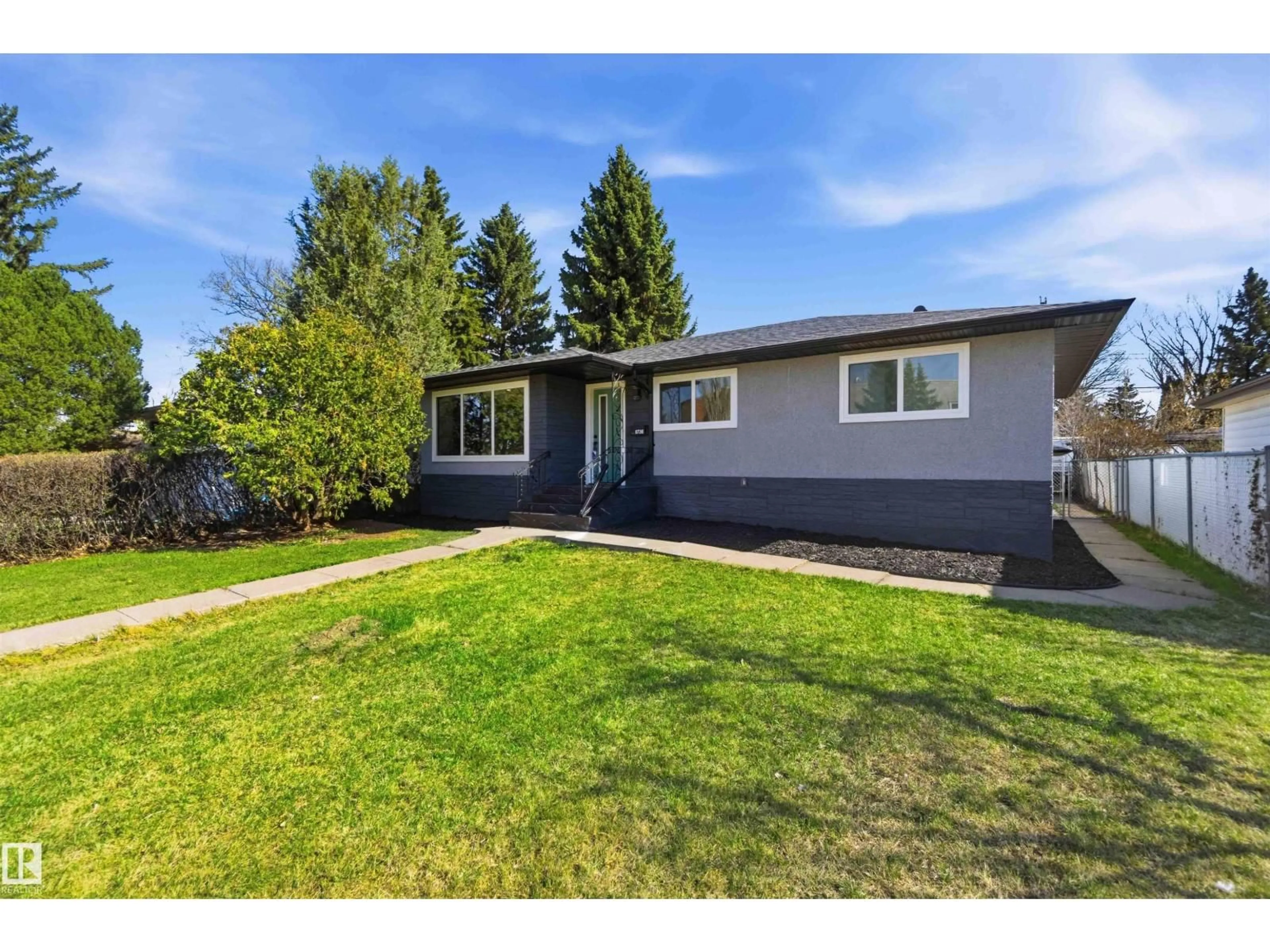 Home with vinyl exterior material, street for 8736 66 AV, Edmonton Alberta T6E0L3