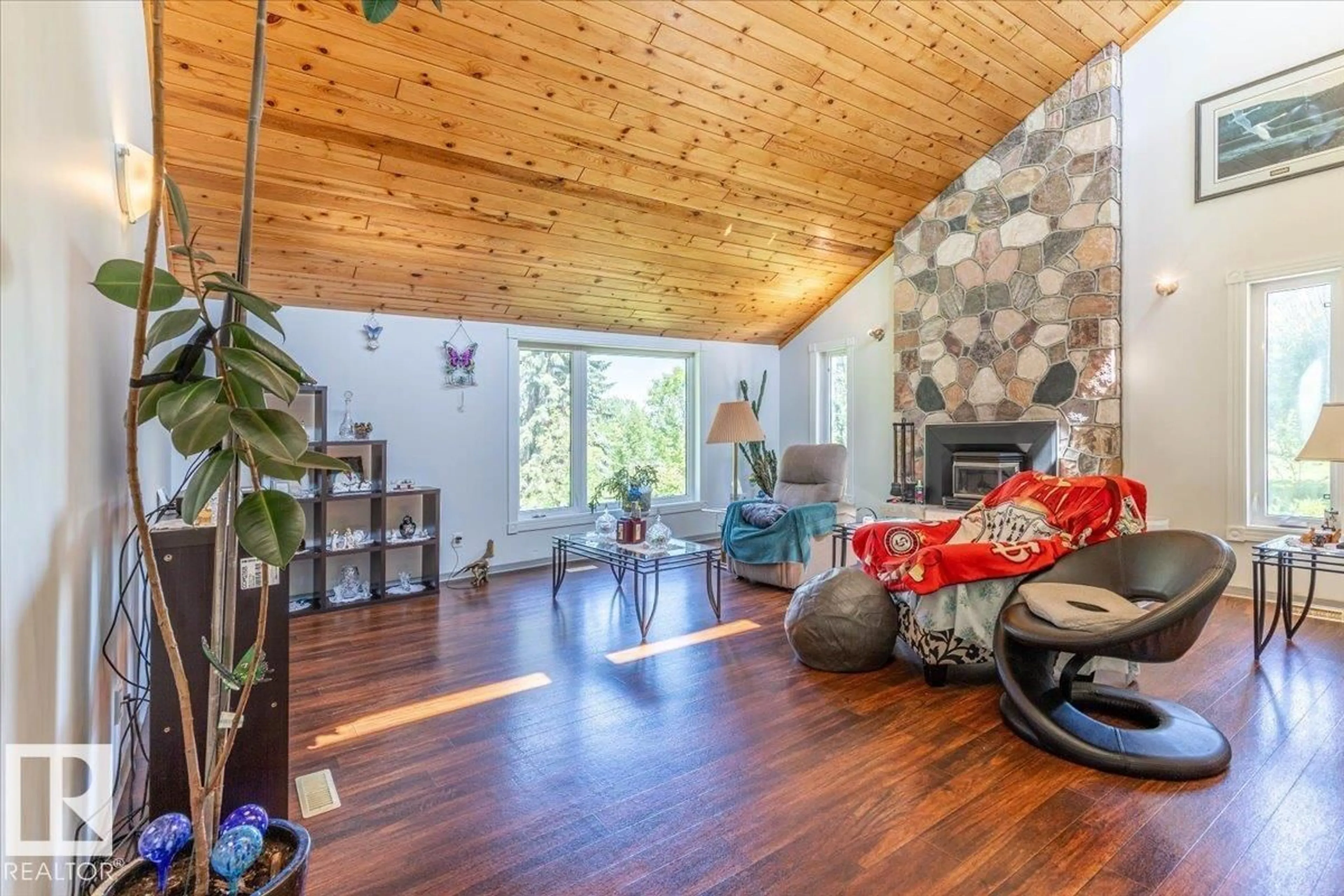 Living room with furniture, wood/laminate floor for 8 - 465070 RGE ROAD 20, Rural Wetaskiwin County Alberta T9A1V5