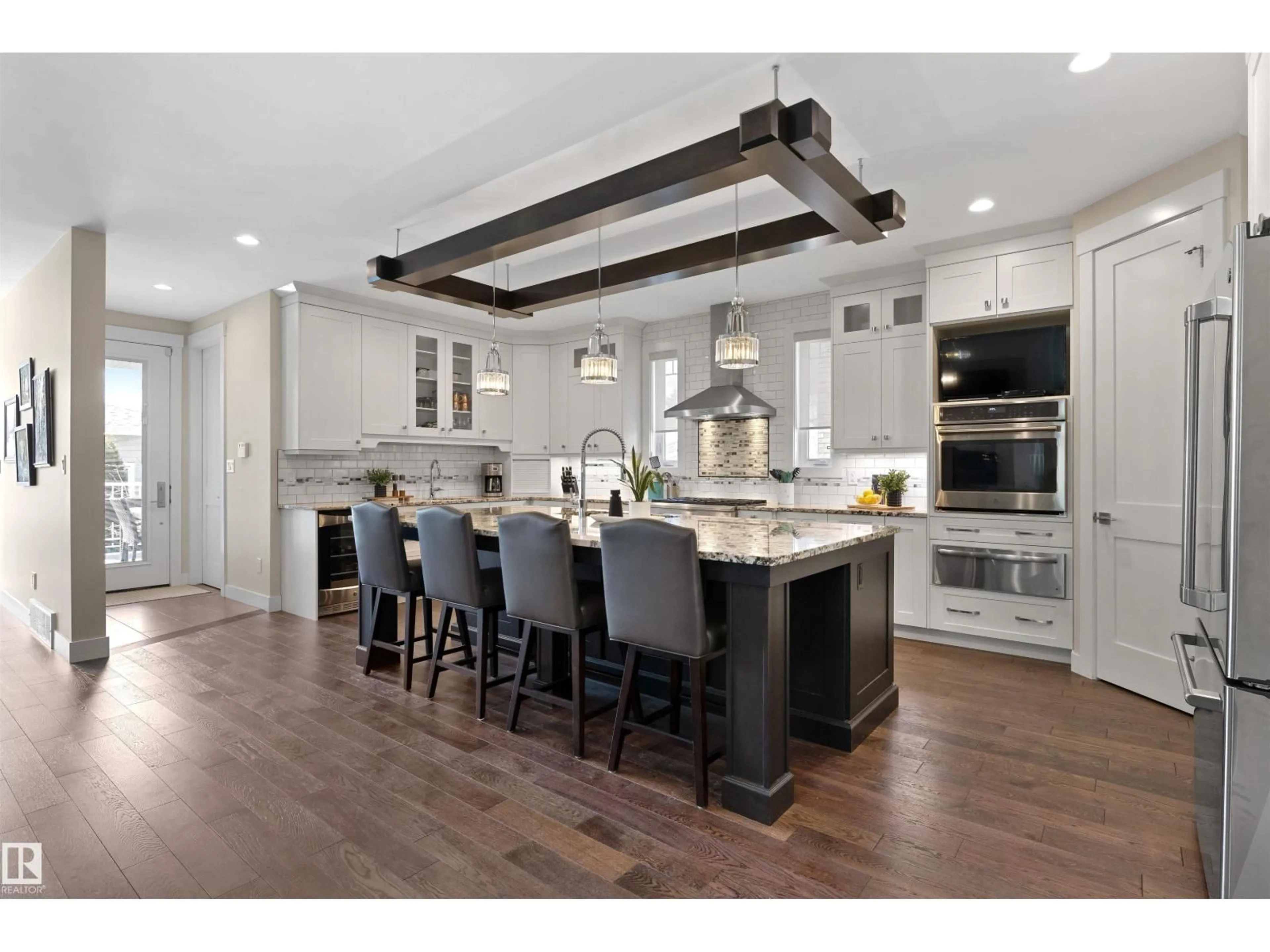 Open concept kitchen, wood/laminate floor for 7931 112S AV, Edmonton Alberta T5B0H6