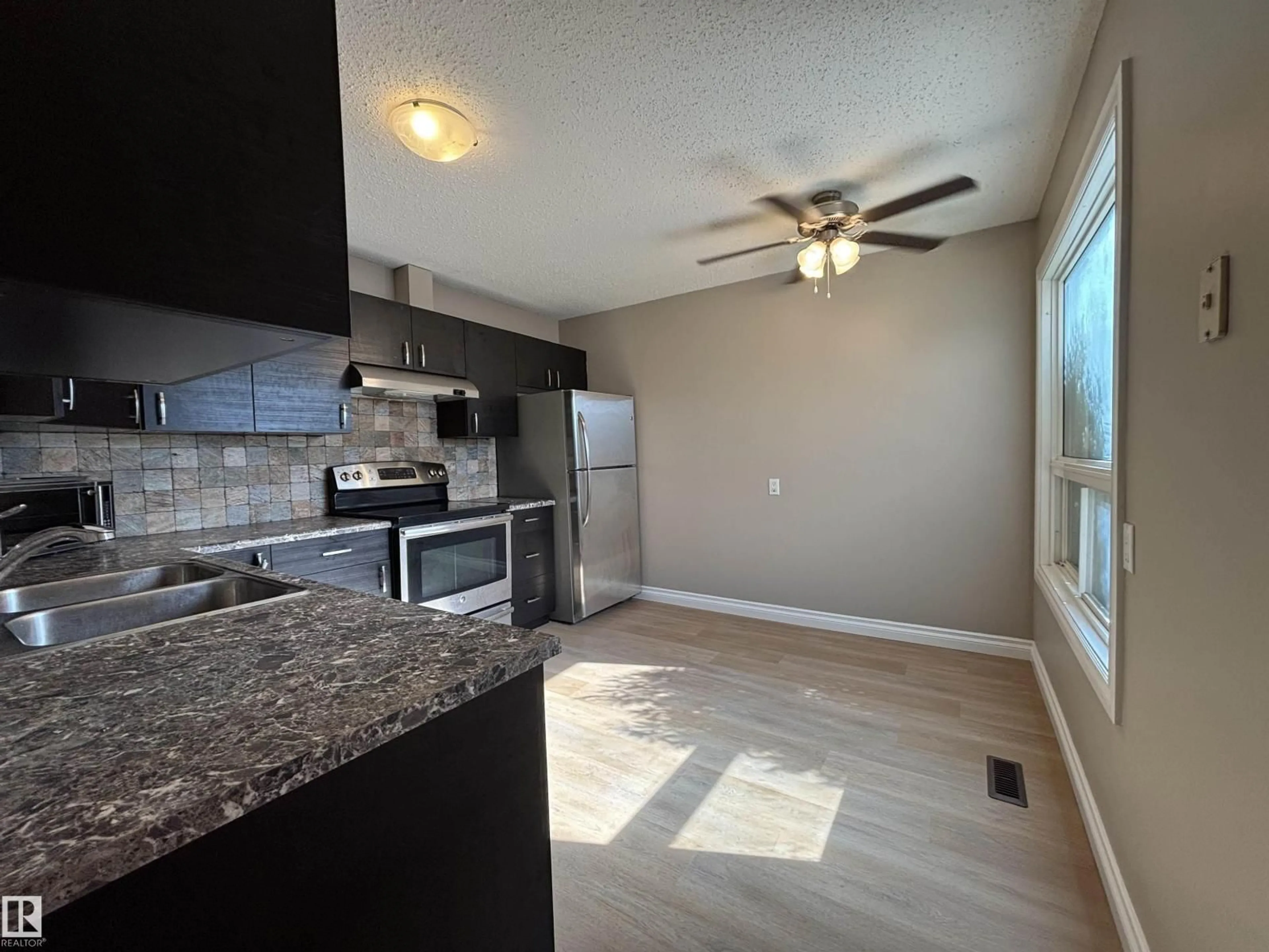Open concept kitchen, unknown for 587 KNOTTWOOD RD W NW, Edmonton Alberta T6K2V6