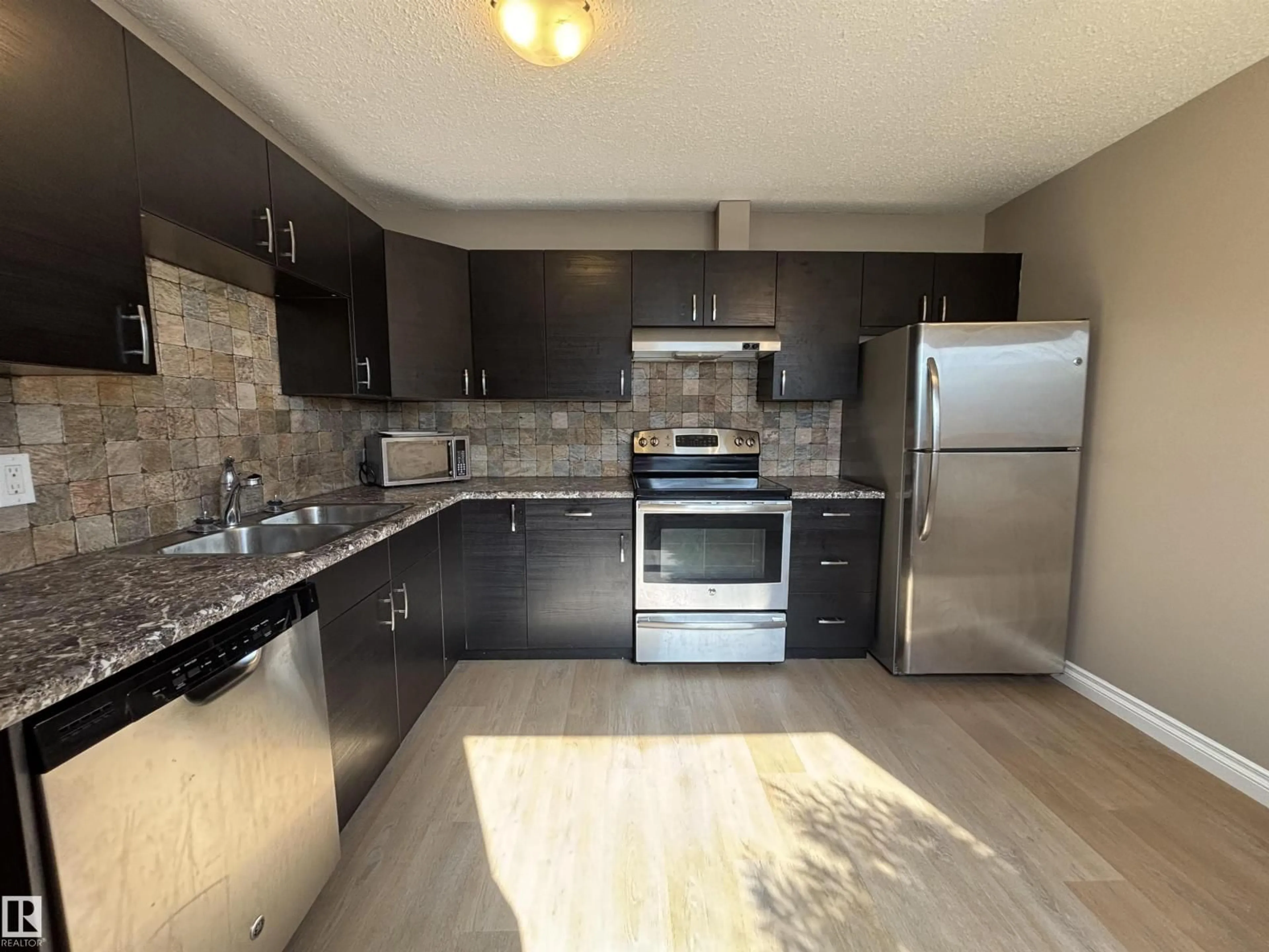 Open concept kitchen, unknown for 587 KNOTTWOOD RD W NW, Edmonton Alberta T6K2V6