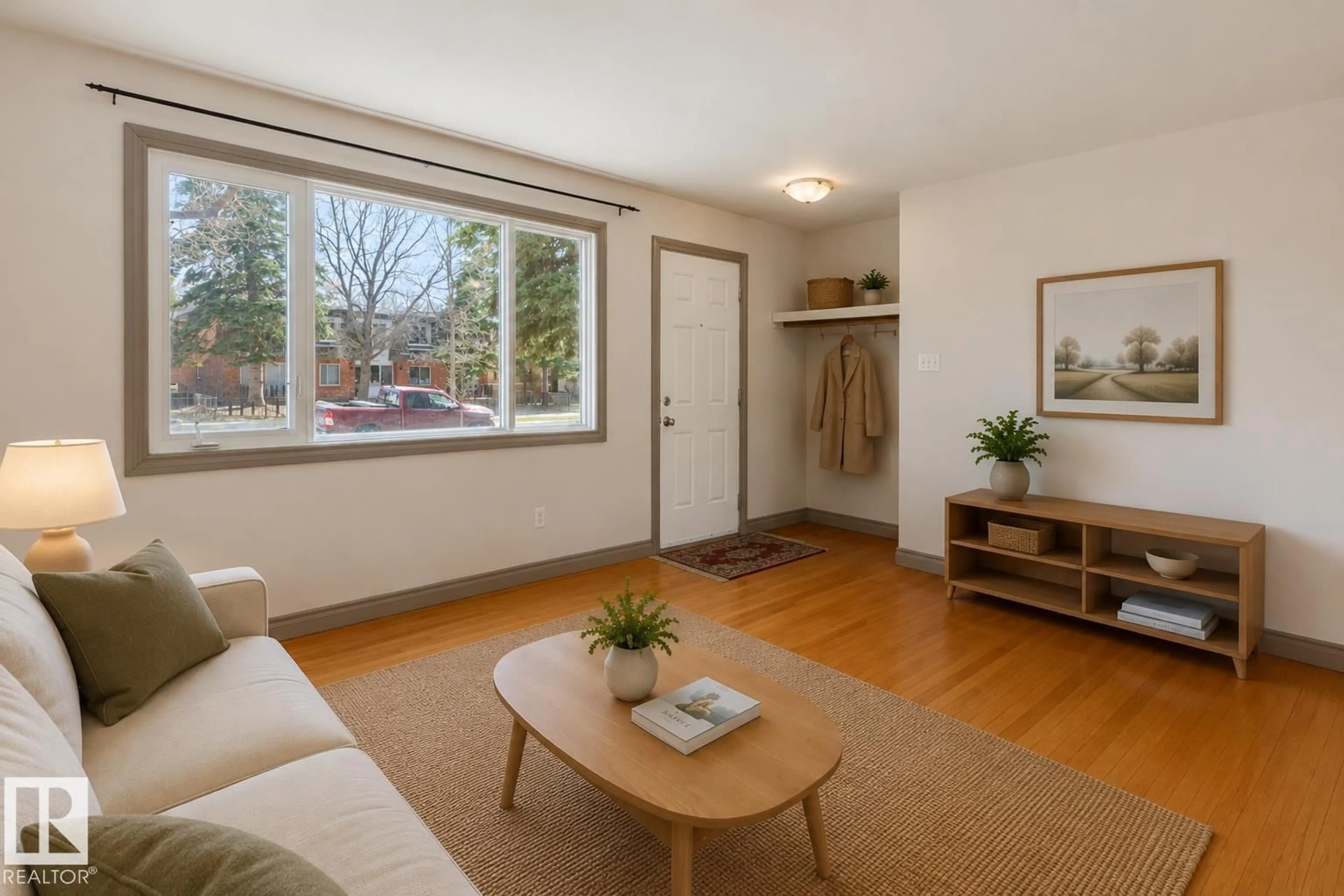 Living room with furniture, wood/laminate floor for 10620 68 AV, Edmonton Alberta T6H2B4