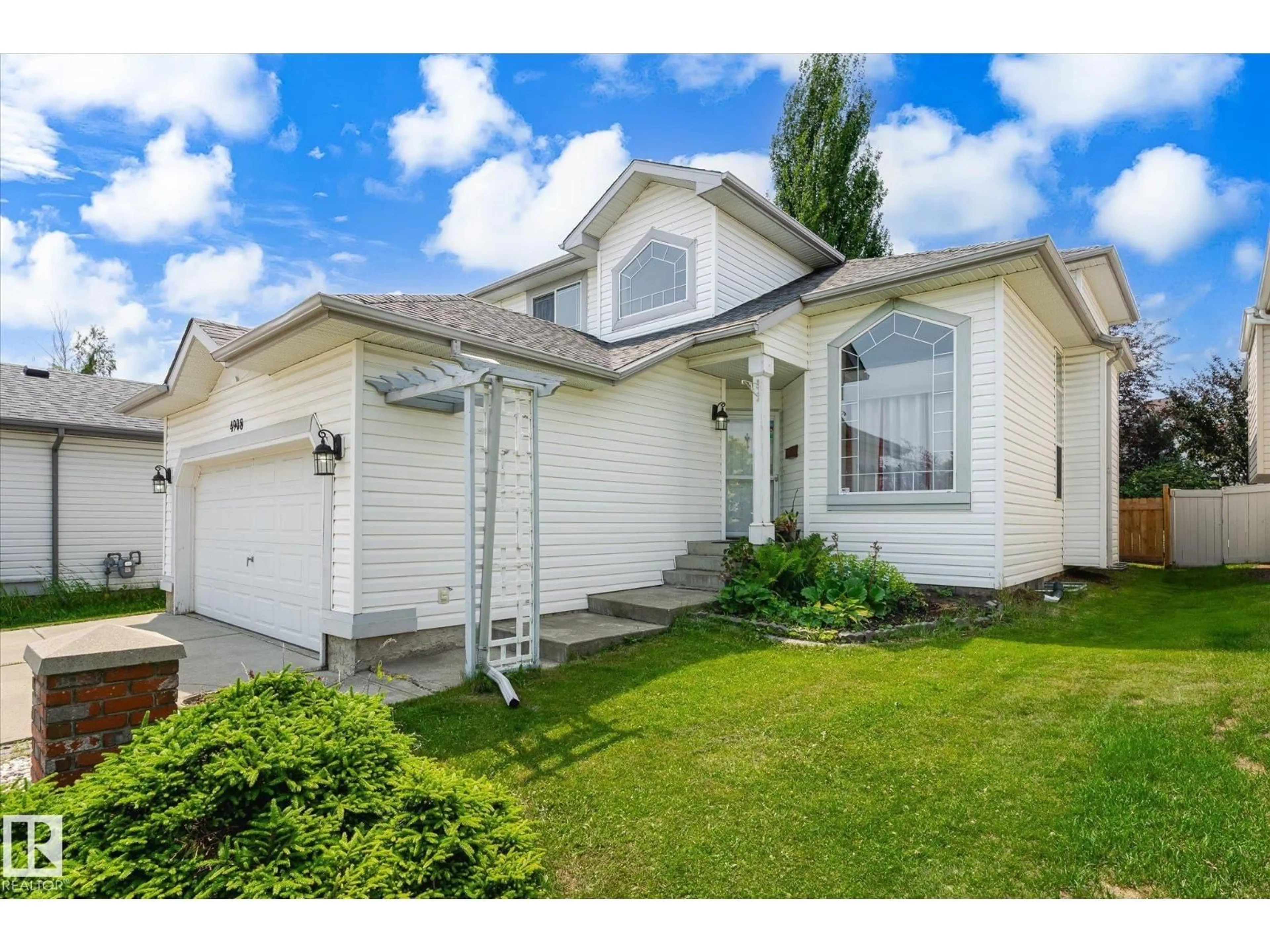 Home with vinyl exterior material, street for NW - 4908 187 ST, Edmonton Alberta T6M2R7