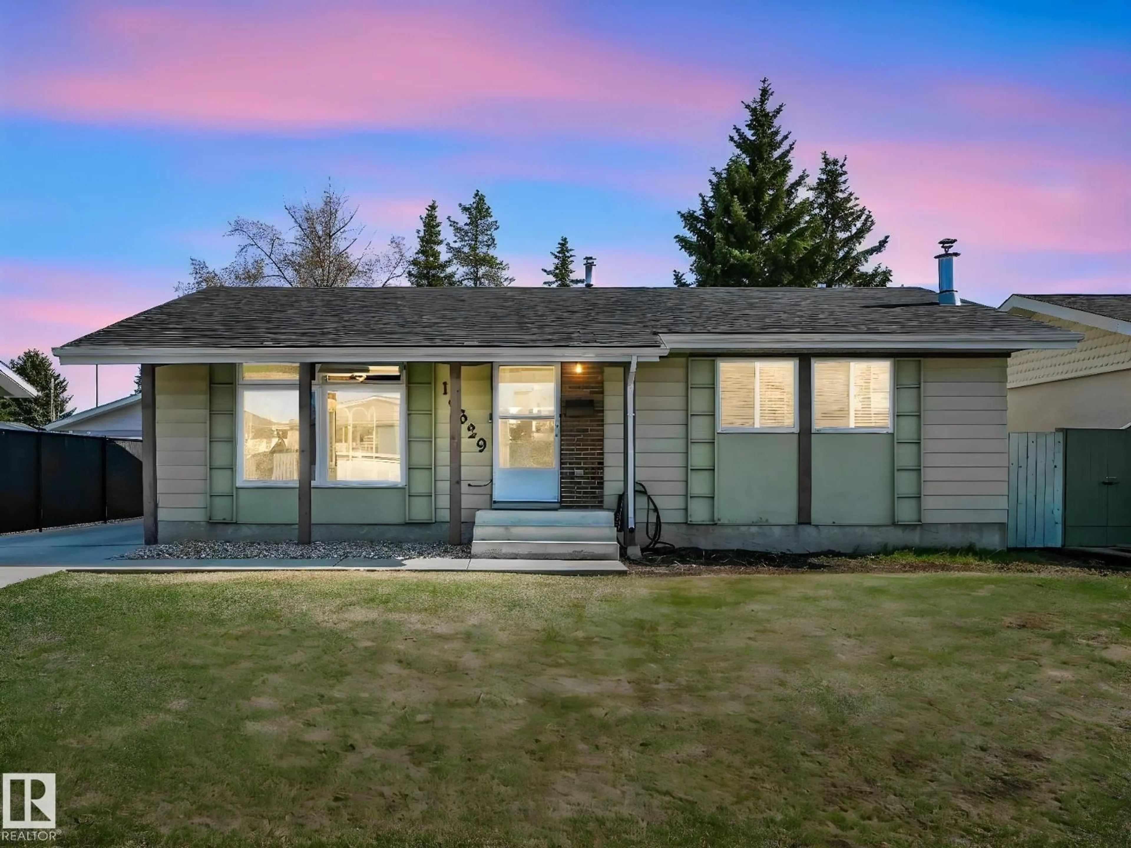 Home with vinyl exterior material, street for NW - 10629 167A AV, Edmonton Alberta T5X2Y9